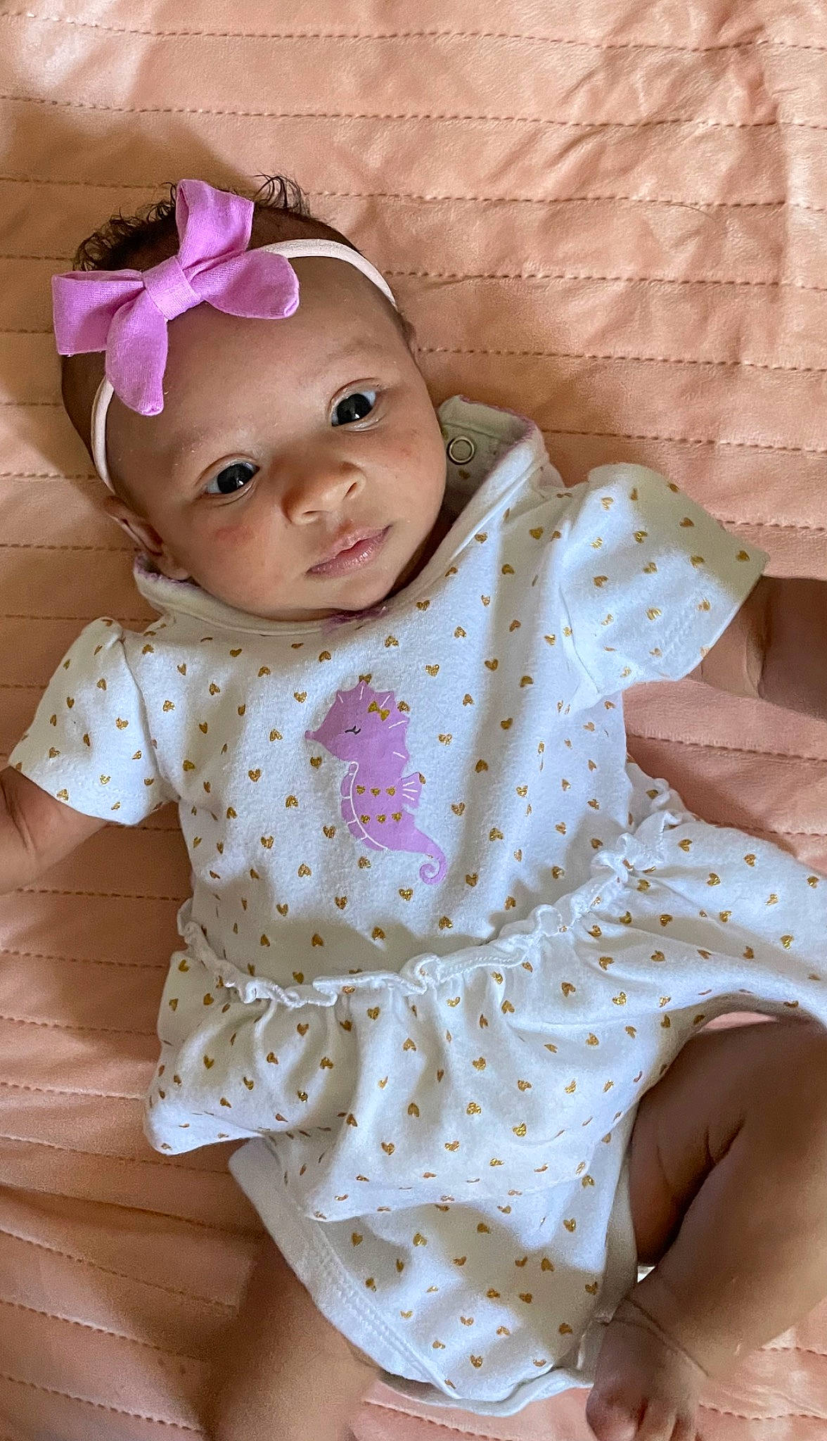 Mia joined the competition — help win amazing prizes! baby, baby_toddler_clothing, cheek, child, chin, collar, dress, dress_shirt, eye, face, fashion_accessory, head, headwear, lip, pattern, person, pink, sitting, skin, sleeve