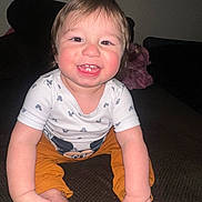 Luigi joined the competition — help win amazing prizes! baby, child, clothing, cute, face, feet, hands, happy, indoor, mickey_mouse, orange_pants, person, playful, portrait, rosy_cheeks, sitting, smiling, toddler, white_shirt, young_child