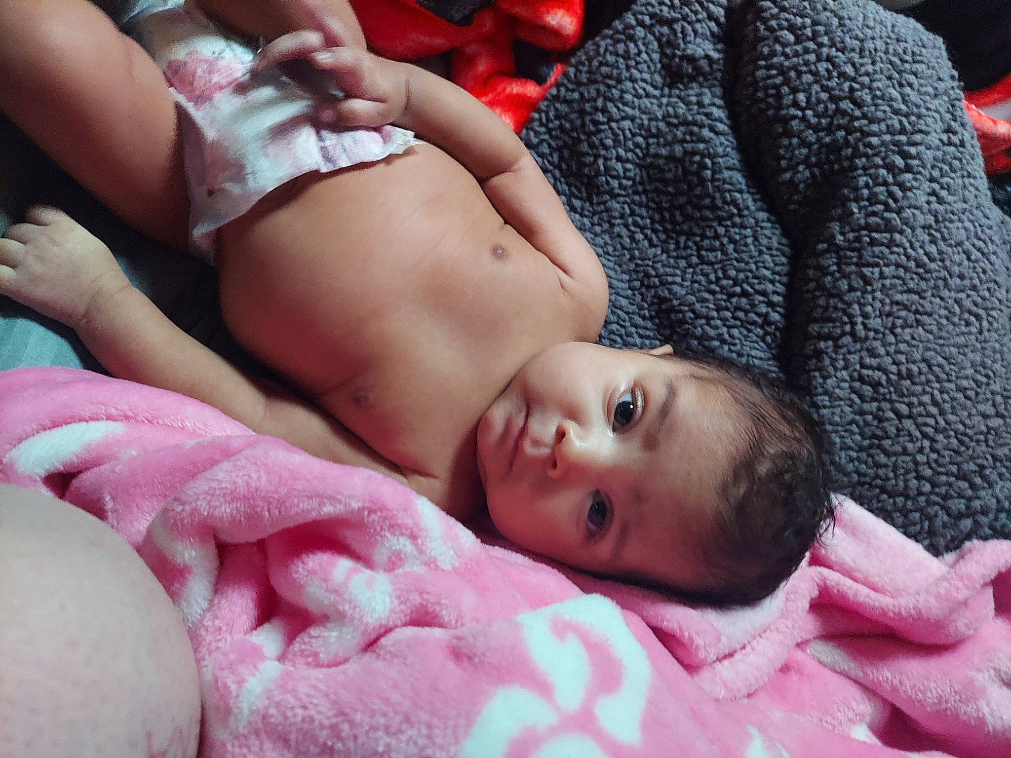 Amara joined the competition — help win amazing prizes! abdomen, bedding, black_hair, chest, child, comfort, flesh, fur, grass, human_leg, linens, lingerie, magenta, pattern, person, pink, sitting, skin, thigh, toddler