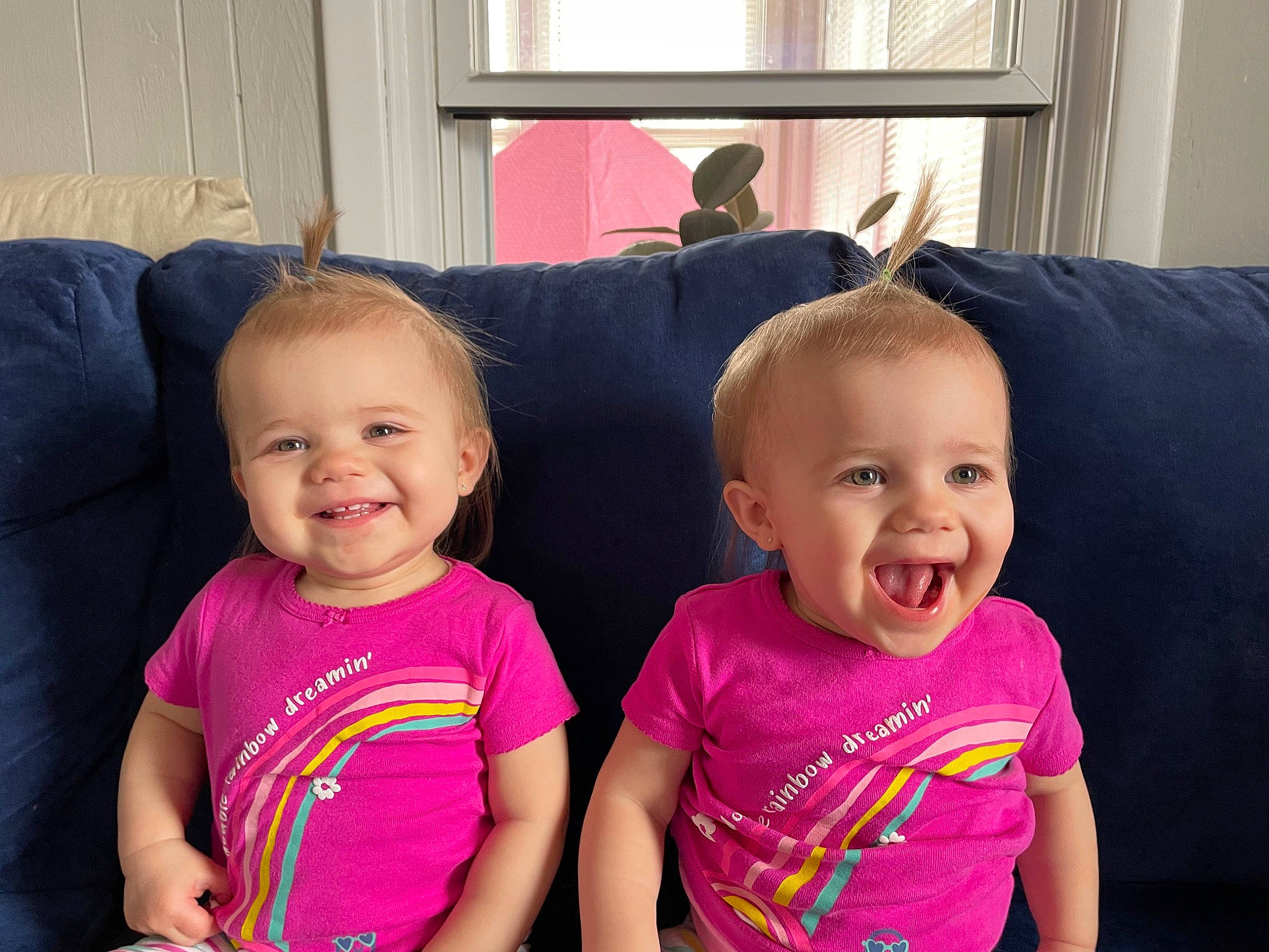 Evalyn joined the competition — help win amazing prizes! baby_toddler_clothing, cheek, comfort, couch, eye, face, facial_expression, hairstyle, happy, head, iris, joy, mammal, organ, person, pink, skin, sleeve, smile, standing