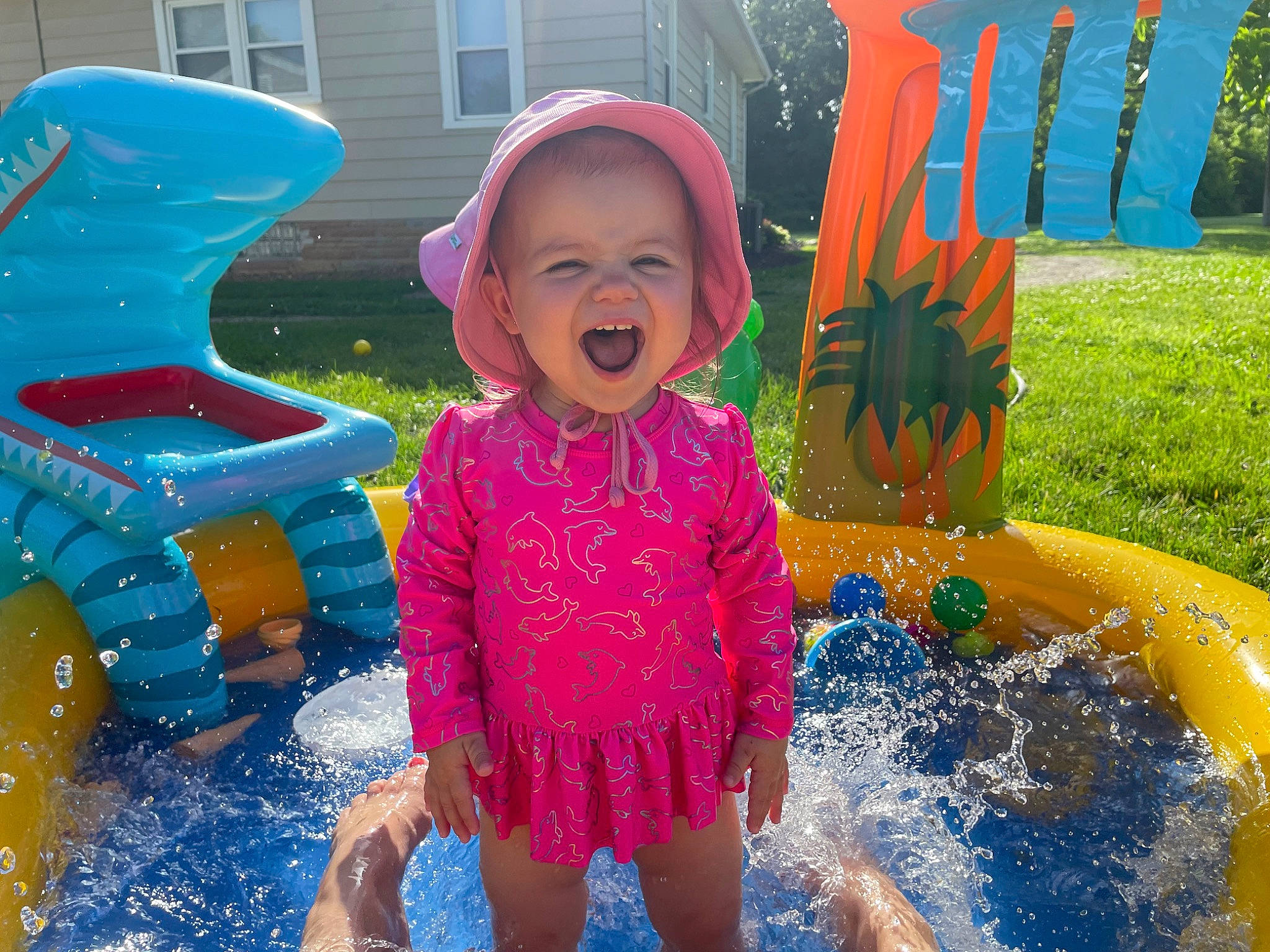 Evalyn is registered to the contest to win money with this photo: aqua, blue, facial_expression, fun, green, happy, leisure, person, photograph, pink, playground, product, public_space, purple, recreation, red, smile, summer, toddler, water