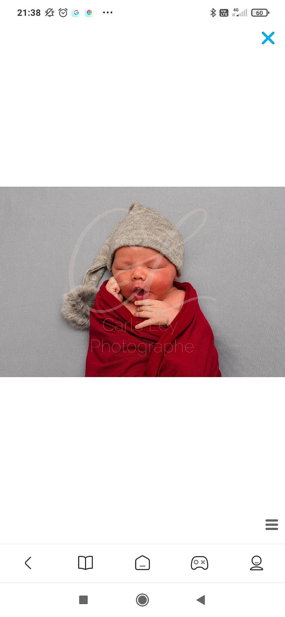 Nino participe au concours pour gagner de l'argent avec cette photo : baby, baby_toddler_clothing, cap, comfort, eye, face, fur, happy, hat, head, headwear, hood, jacket, knit_cap, linens, magenta, nose, outerwear, person, sleeve