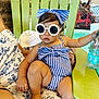 toddler, child, sunglasses, blue_stripes, bow, green_chair, water_bottle, summer, fashion, cute, baby, relaxing, indoor, person, casual, stylish, accessory, seat, clothing, portrait