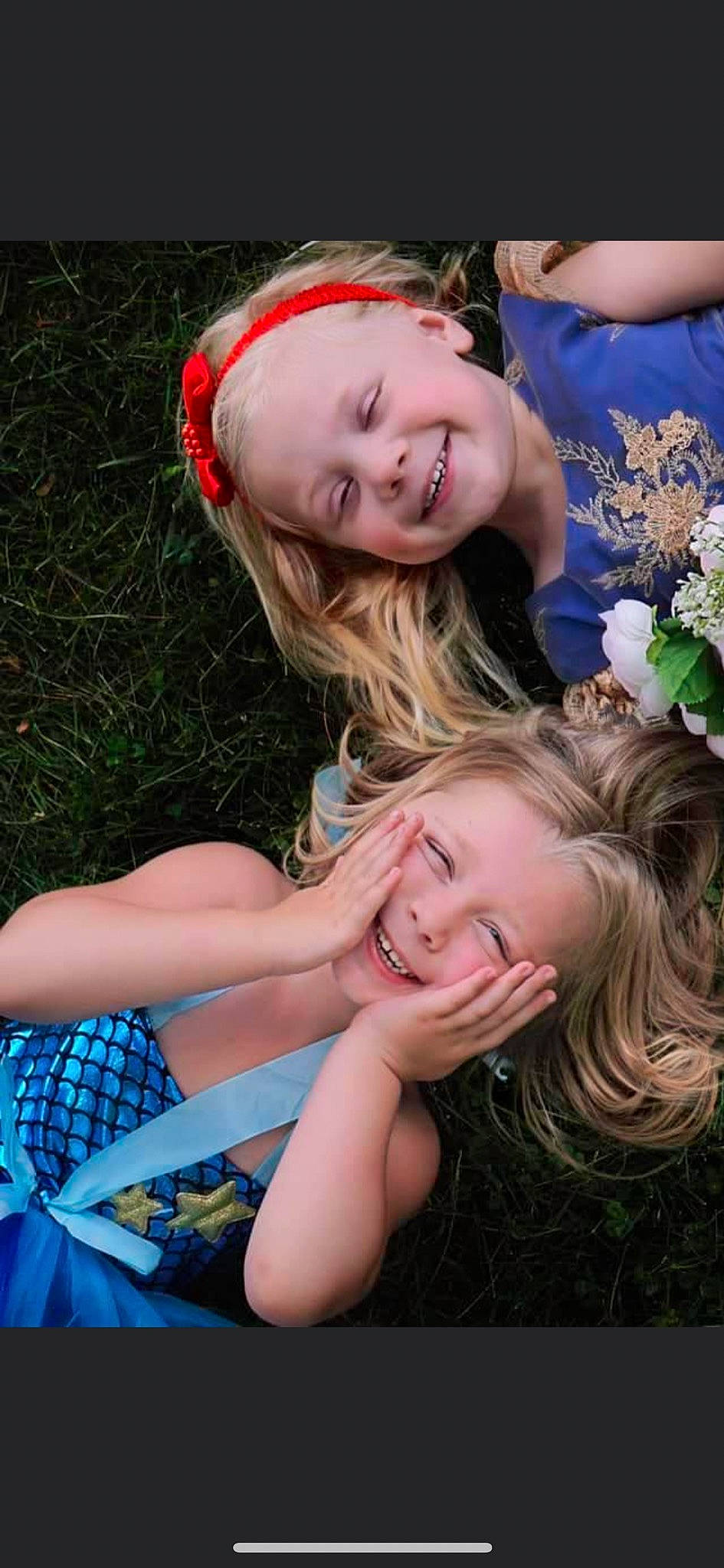 Iris is registered to the contest to win money with this photo: blue, dress, eye, face, facial_expression, flash_photography, flower, fun, gesture, grass, hair, hairstyle, happy, head, interaction, joy, people_in_nature, person, photograph, plant