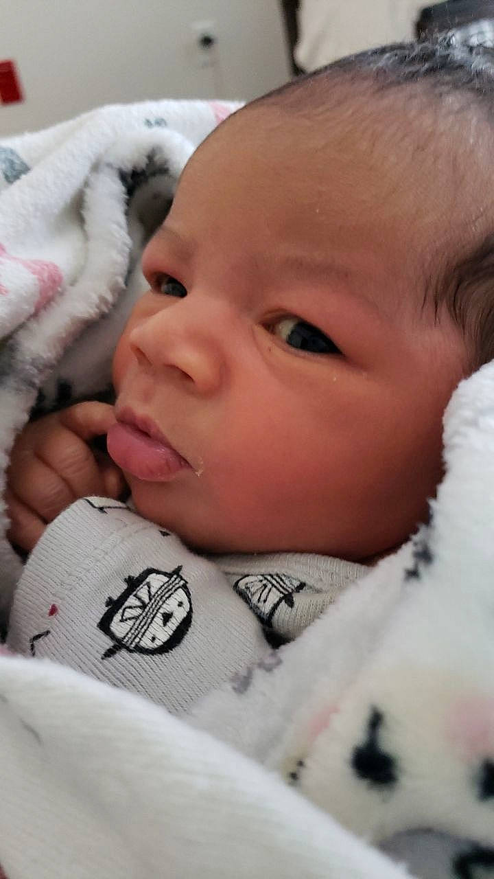 Jaden is registered to the contest to win money with this photo: baby, baby_toddler_clothing, cheek, child, chin, close_up, comfort, ear, eyebrow, eyelash, facial_expression, happy, iris, linens, lip, mouth, nose, person, skin, smile