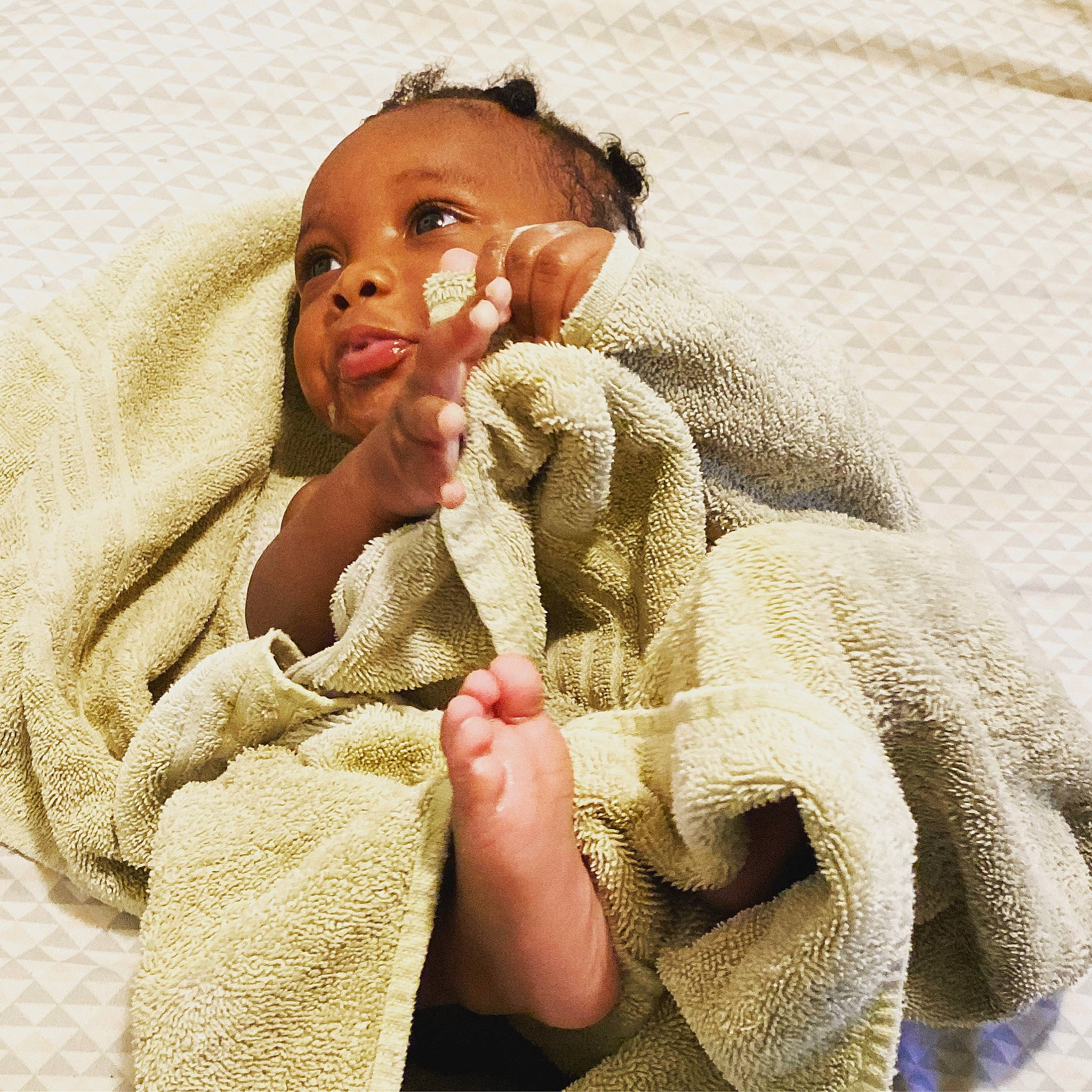 Zakai joined the competition — help win amazing prizes! baby, child, close_up, comfort, facial_expression, finger, fur, gesture, happy, linens, lip, nail, neck, nose, person, skin, sleeve, thumb, vertebrate, wrinkle