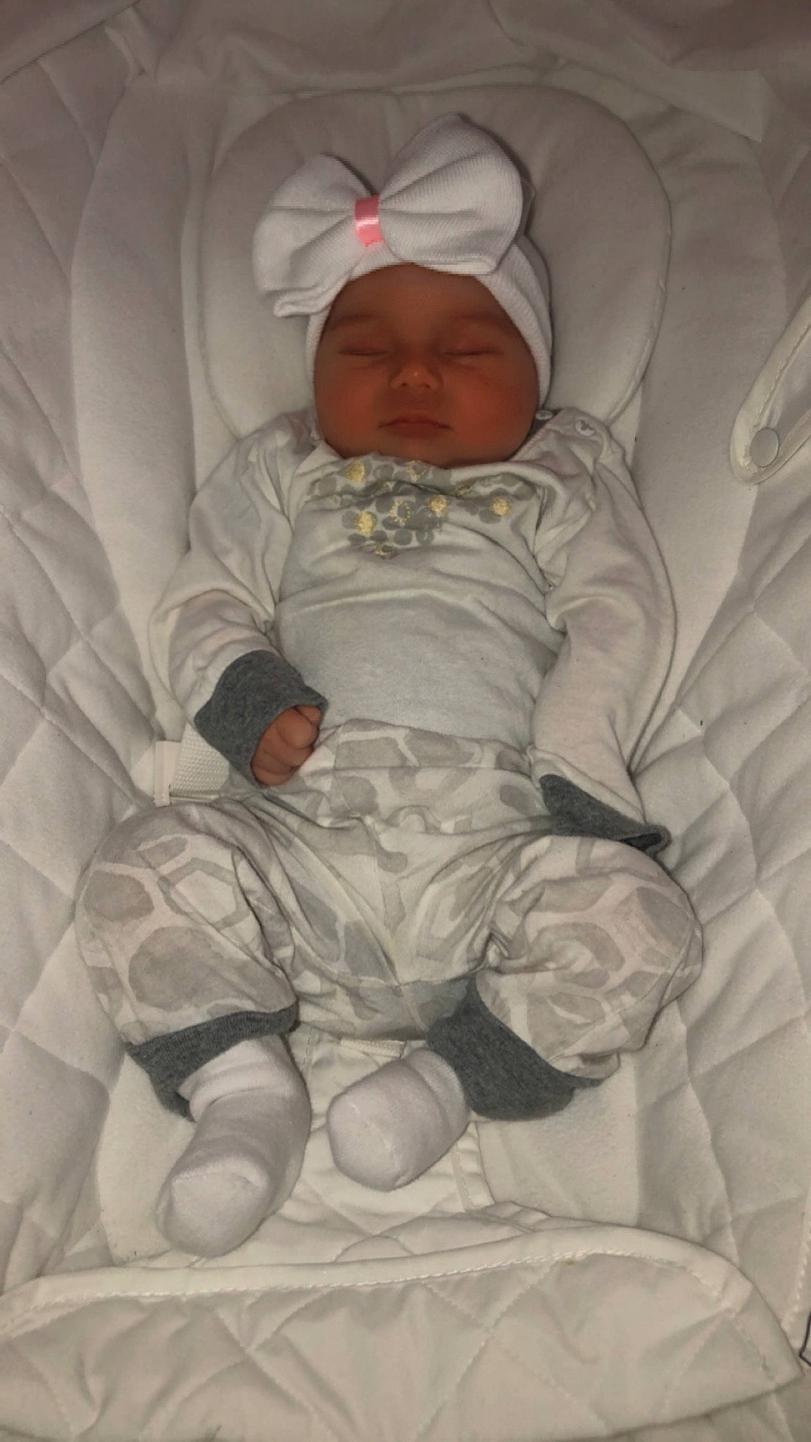 Isabelle is registered to the contest to win money with this photo: baby, baby_products, baby_sleeping, baby_toddler_clothing, carmine, child, comfort, face, foot, head, headwear, linens, person, product, sitting, skin, sleep, sleeve, textile, toddler