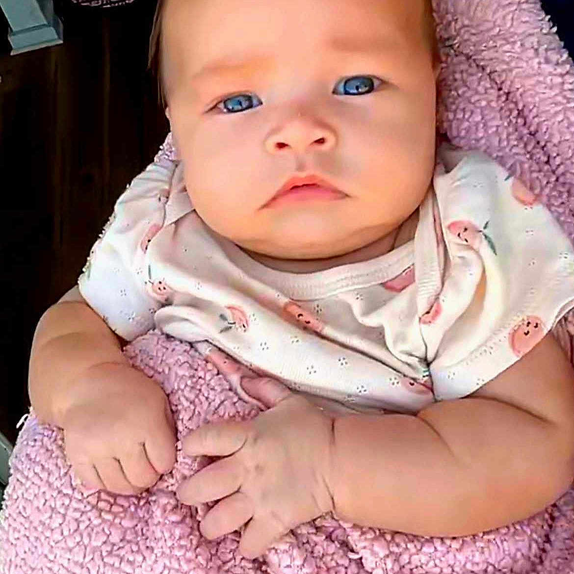 Weslynn joined the competition — help win amazing prizes! adorable, baby, blanket, blue_eyes, child, closeup, clothing, cute, expression, face, hands, indoor, infant, newborn, person, pink, portrait, skin, soft_texture, wrapped