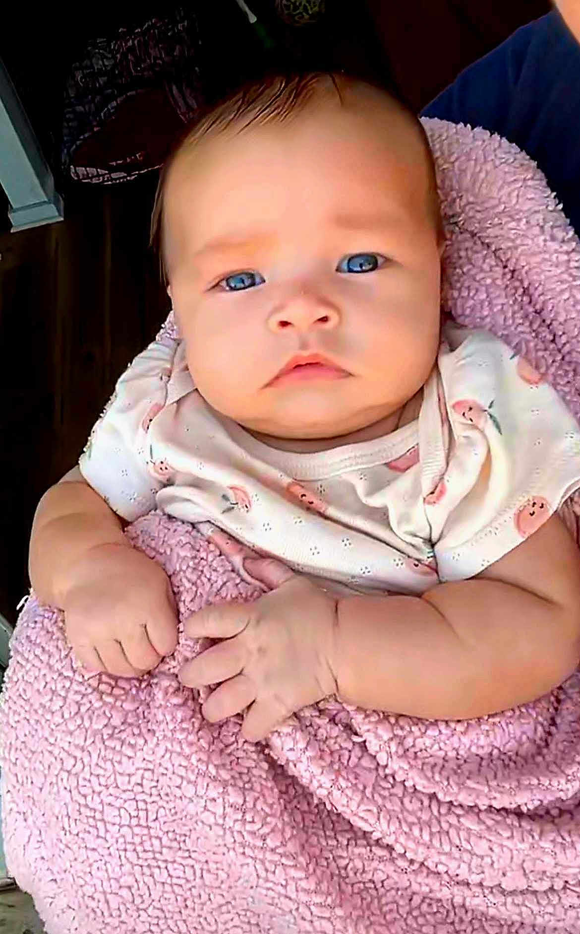 Weslynn joined the competition — help win amazing prizes! baby, infant, blanket, pink, cute, face, hands, blue_eyes, clothing, person, portrait, child, newborn, indoor, soft_texture, expression, skin, closeup, wrapped, adorable