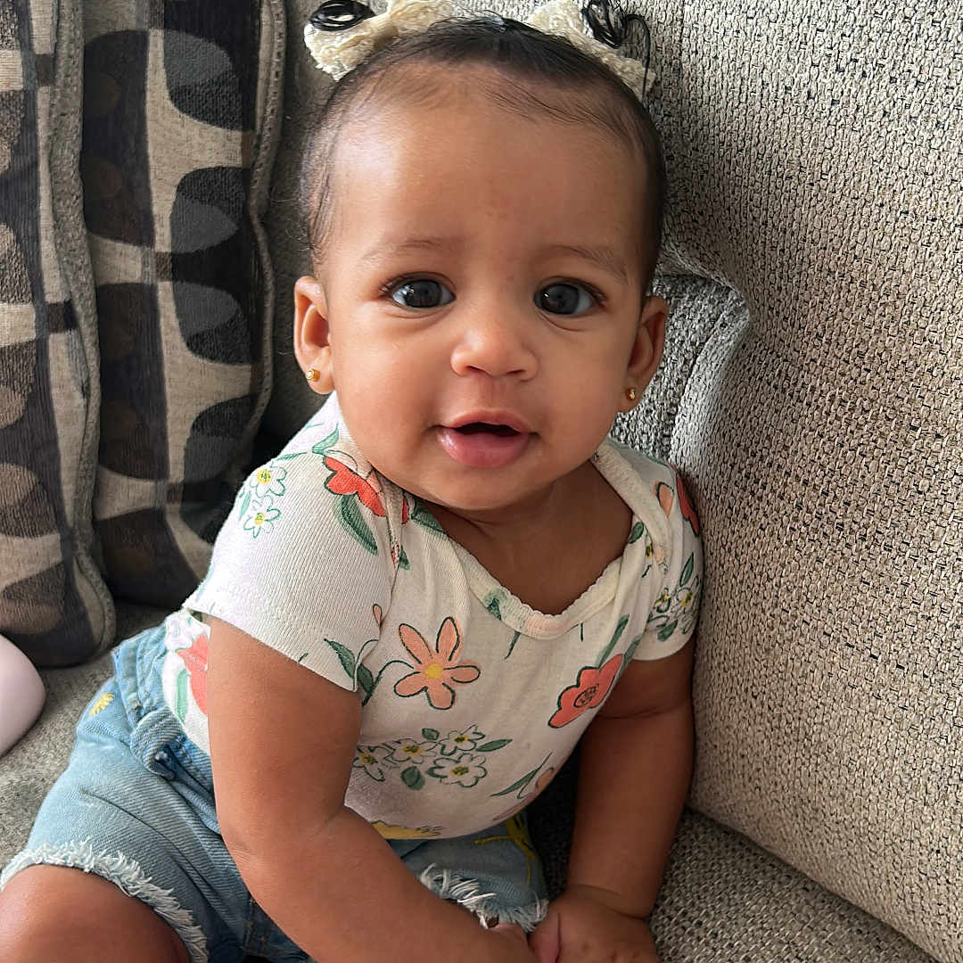 Kylie joined the competition — help win amazing prizes! baby, bodypart, chair, clothing, couch, cushion, face, finger, furniture, hand, head, homedecor, hosiery, pants, person, photography, portrait, shorts, sitting, sock