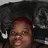 person, cat, sleeping_cat, red_hair, tattoo, black_tank_top, indoor, closeup, face, pet, companion, resting, relaxed, animal, feline, whiskers, cute, cozy, friendship, portrait