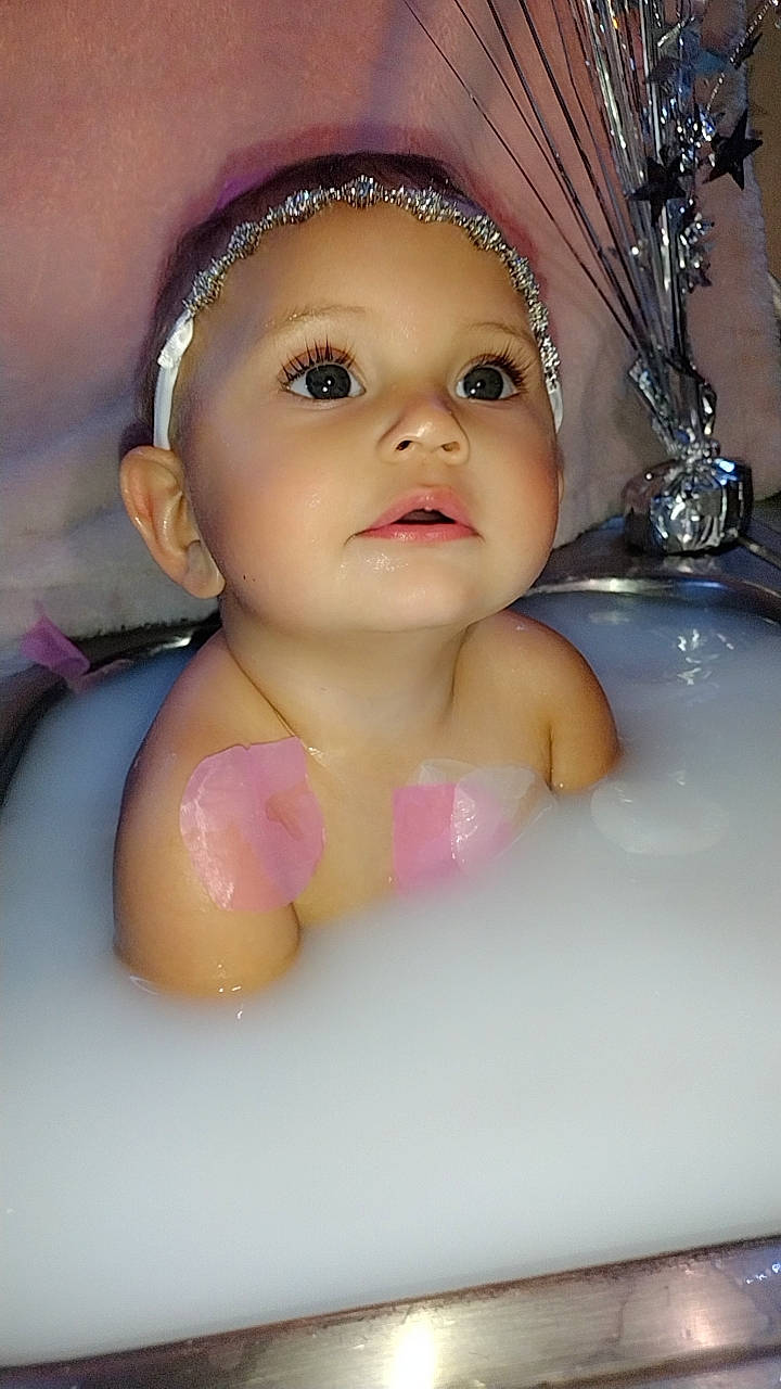 Azaria is registered to the contest to win money with this photo: baby, bathing, beauty, cheek, chest, child, eye, eyebrow, eyelash, finger, fun, happy, jewellery, lip, mouth, nail, person, pink, skin, thumb