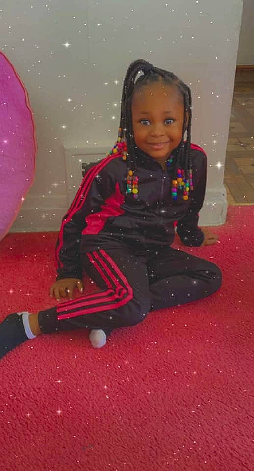 Zaia is registered to the contest to win money with this photo: baby_toddler_clothing, carmine, cheek, child, eye, facial_expression, flooring, fun, hairstyle, happy, head, joy, magenta, pattern, person, pink, purple, room, sitting, sleeve