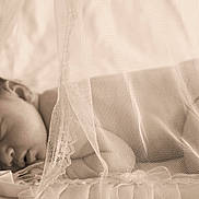 Brooklynn is registered to the contest to win money with this photo: baby, newborn, sleeping, lace, canopy, blanket, soft, sepia, portrait, peaceful, infant, closeup, indoor, delicate, cozy, resting, head, face, fabric, texture