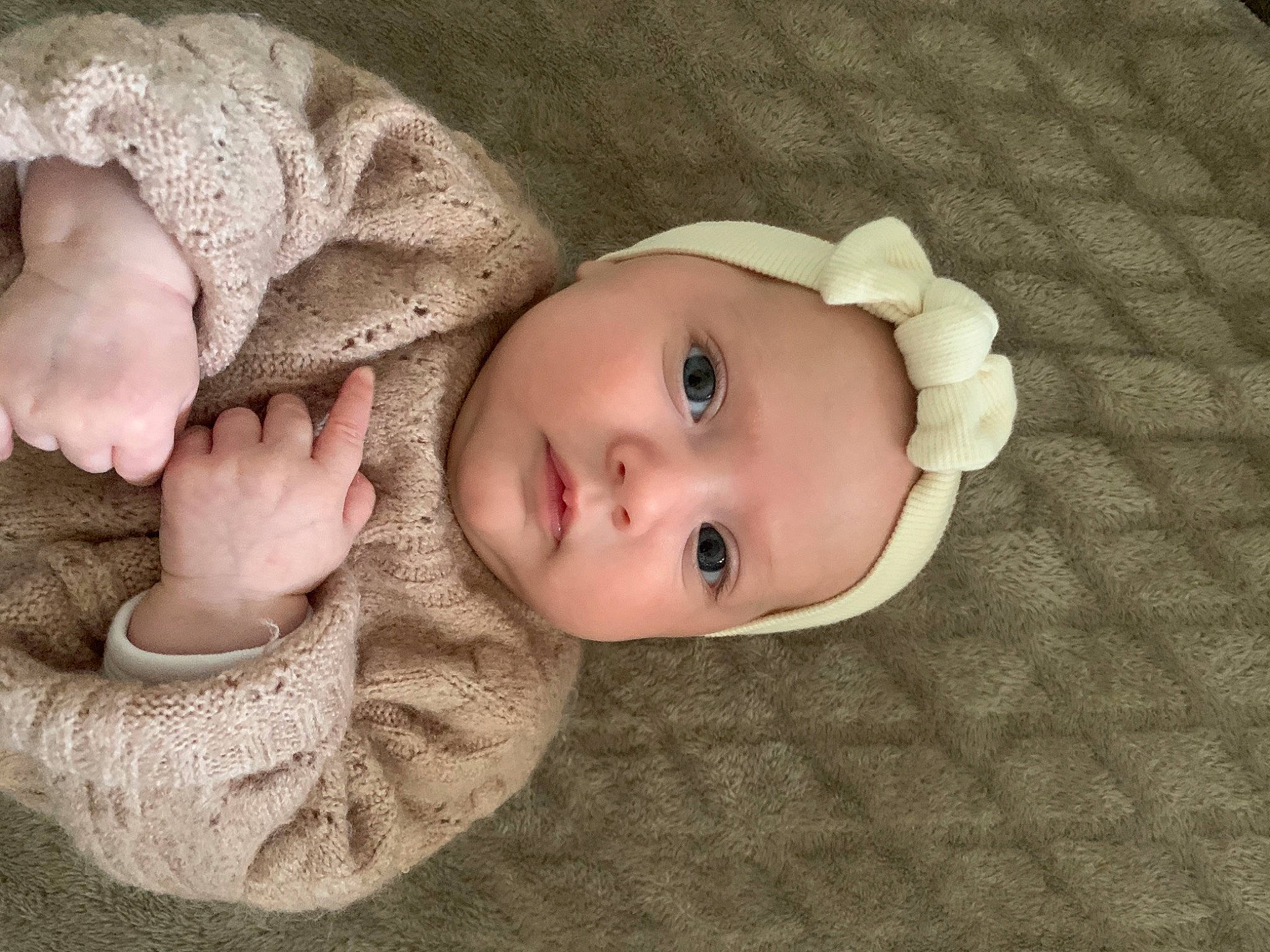 Nina participe au concours pour gagner de l'argent avec cette photo : baby, baby_toddler_clothing, cheek, chin, clothing, comfort, eye, face, facial_expression, gesture, head, headgear, headwear, iris, lip, nose, outerwear, person, skin, sleeve