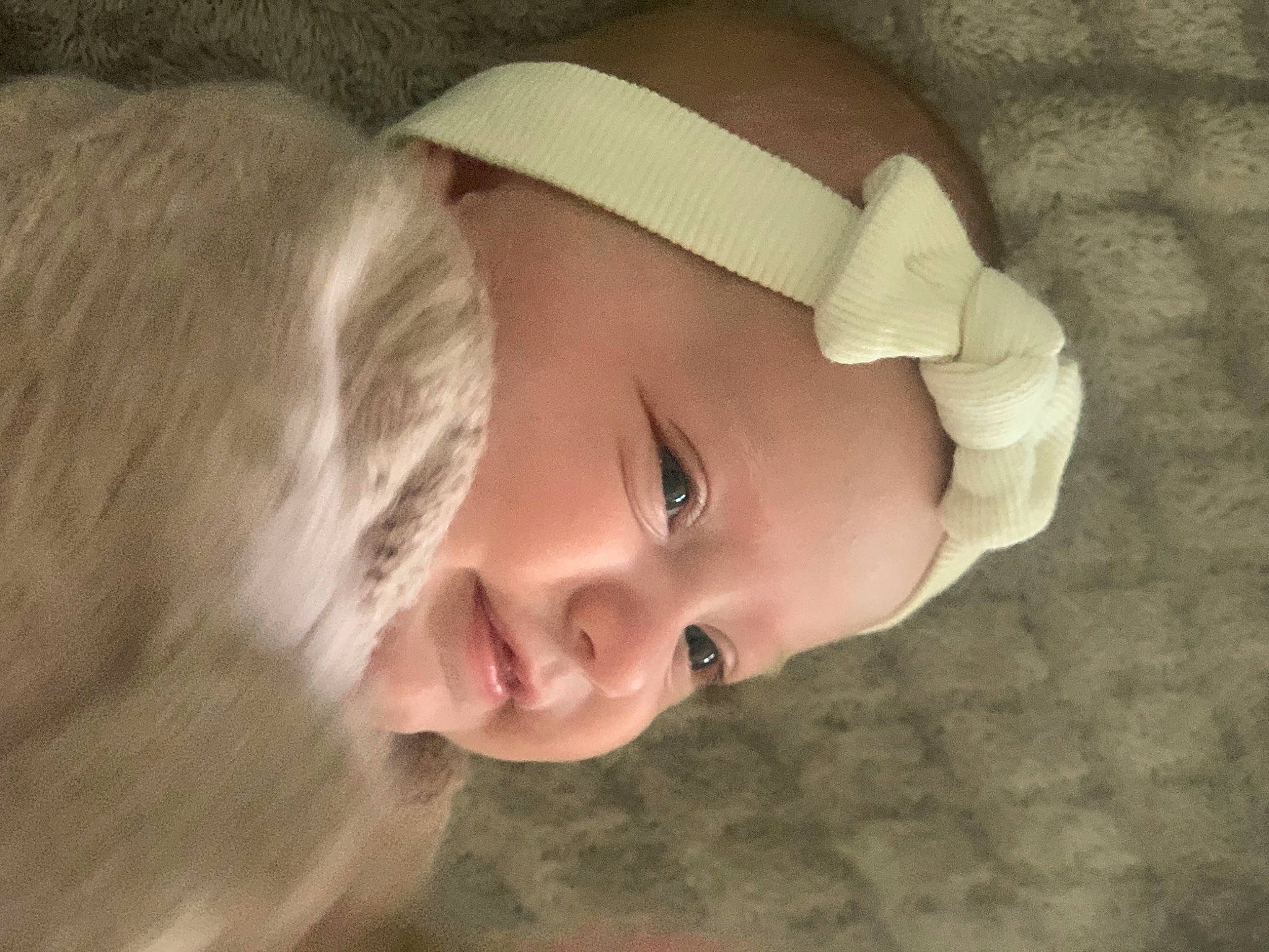 Nina participe au concours pour gagner de l'argent avec cette photo : baby, baby_toddler_clothing, cheek, child, eye, eyebrow, face, flash_photography, happy, headgear, headwear, iris, lip, nose, person, sitting, skin, smile, toddler, tree