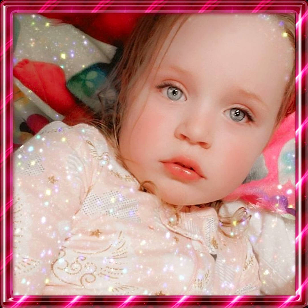 Jaina joined the competition — help win amazing prizes! baby, brown_hair, cheek, child, child_model, eye, eyelash, face, head, lip, nose, person, photography, photomontage, picture_frame, pink, skin, smile, toddler