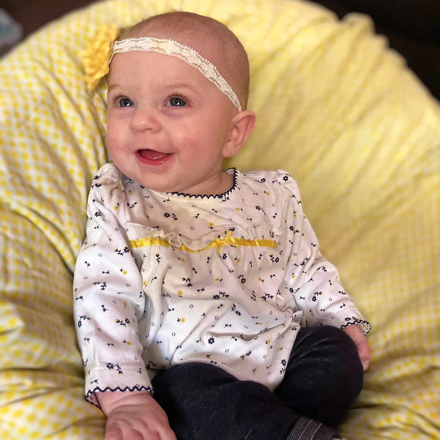 Troylynn is registered to the contest to win money with this photo: accessories, baby, bodypart, chair, clothing, couch, cushion, face, furniture, happy, head, homedecor, jeans, pants, person, photography, portrait, sitting, smile, t_shirt