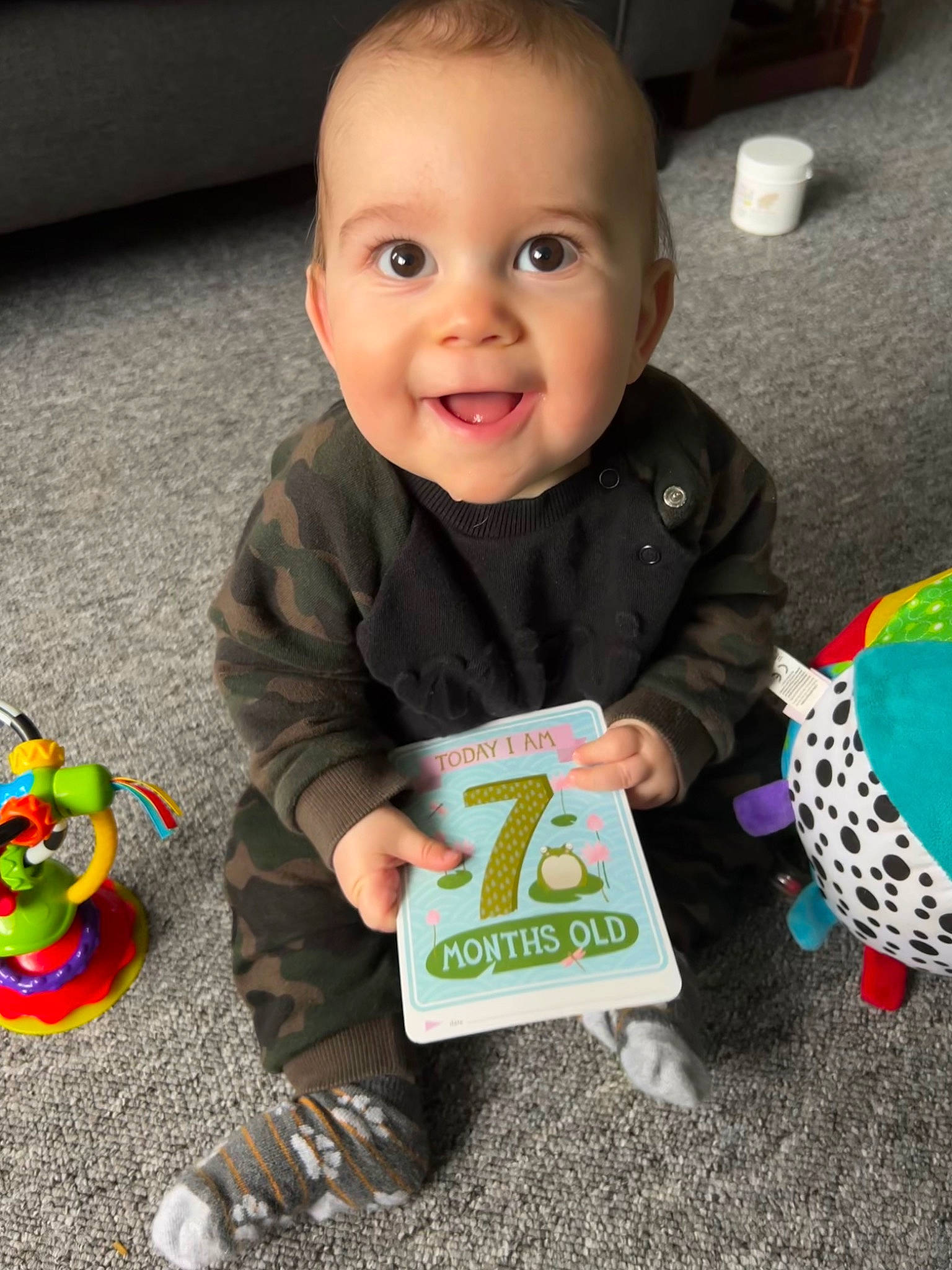Issac joined the competition — help win amazing prizes! baby, baby_products, baby_toddler_clothing, cheek, child, facial_expression, finger, flooring, fun, grass, green, happy, head, joy, person, skin, sleeve, smile, standing, t_shirt