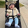 Finnley joined the competition — help win amazing prizes! baby, child, stroller, hoodie, smiling, outdoor, sidewalk, street, cute, happy, clothing, footwear, person, urban, greenery, tree, car, residential, daylight, portrait