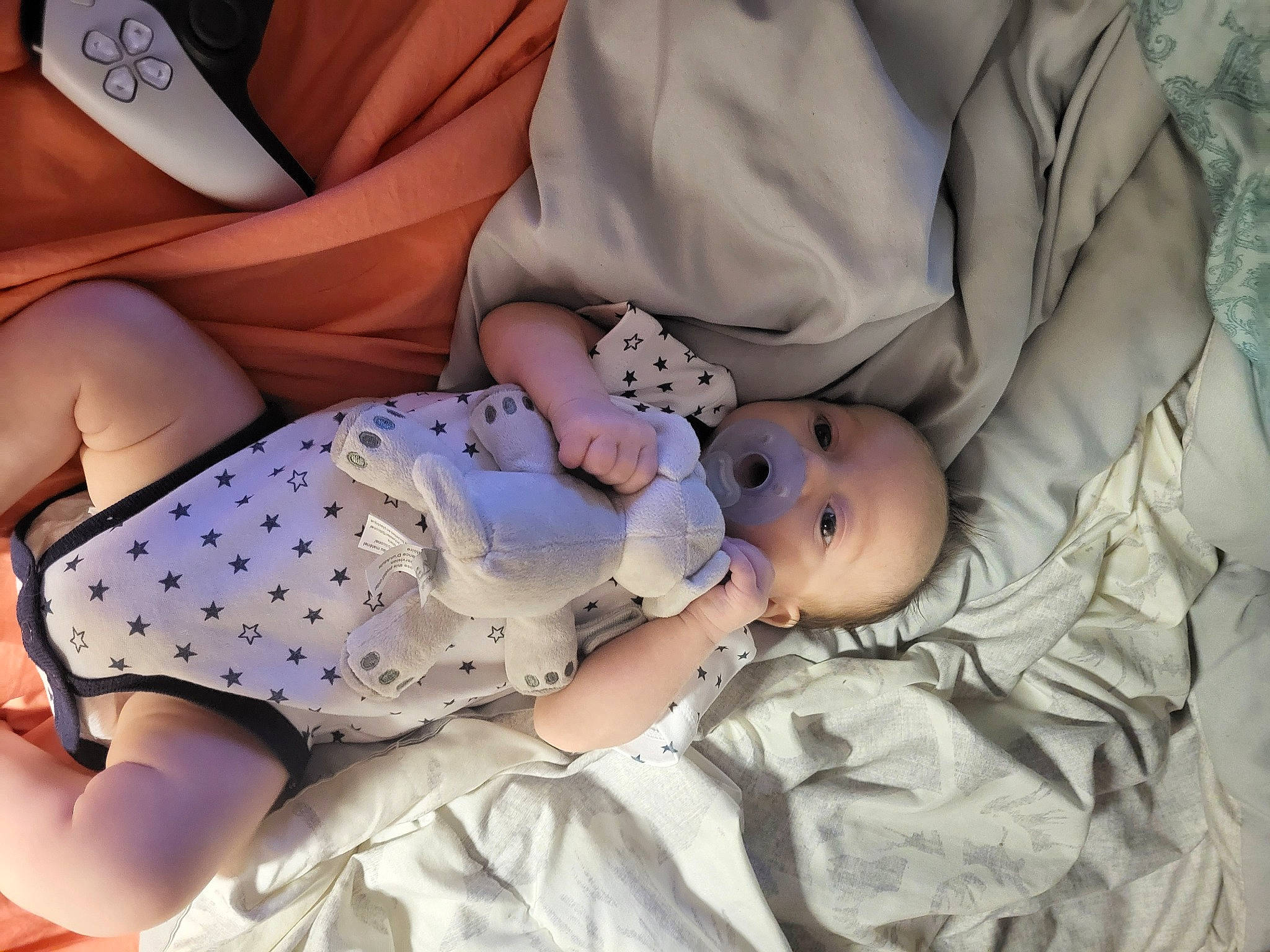 Kyler is registered to the contest to win money with this photo: baby, baby_toddler_clothing, child, comfort, day_dress, dress, finger, hat, human_body, human_leg, knee, linens, nail, pattern, person, product, sitting, skin, textile, thigh