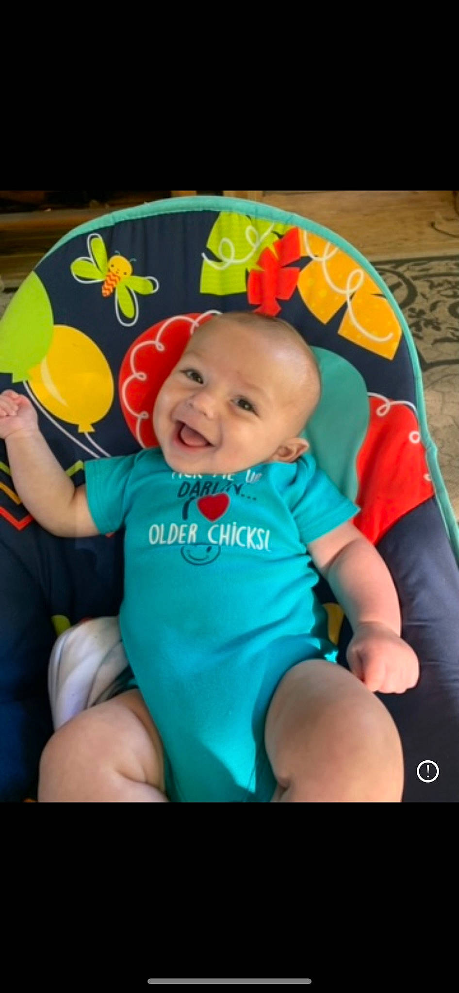 Bellamy is registered to the contest to win money with this photo: baby, baby_toddler_clothing, chair, cheek, child, eye, finger, fun, happy, iris, joy, leisure, person, pink, product, sitting, skin, smile, snapshot, t_shirt