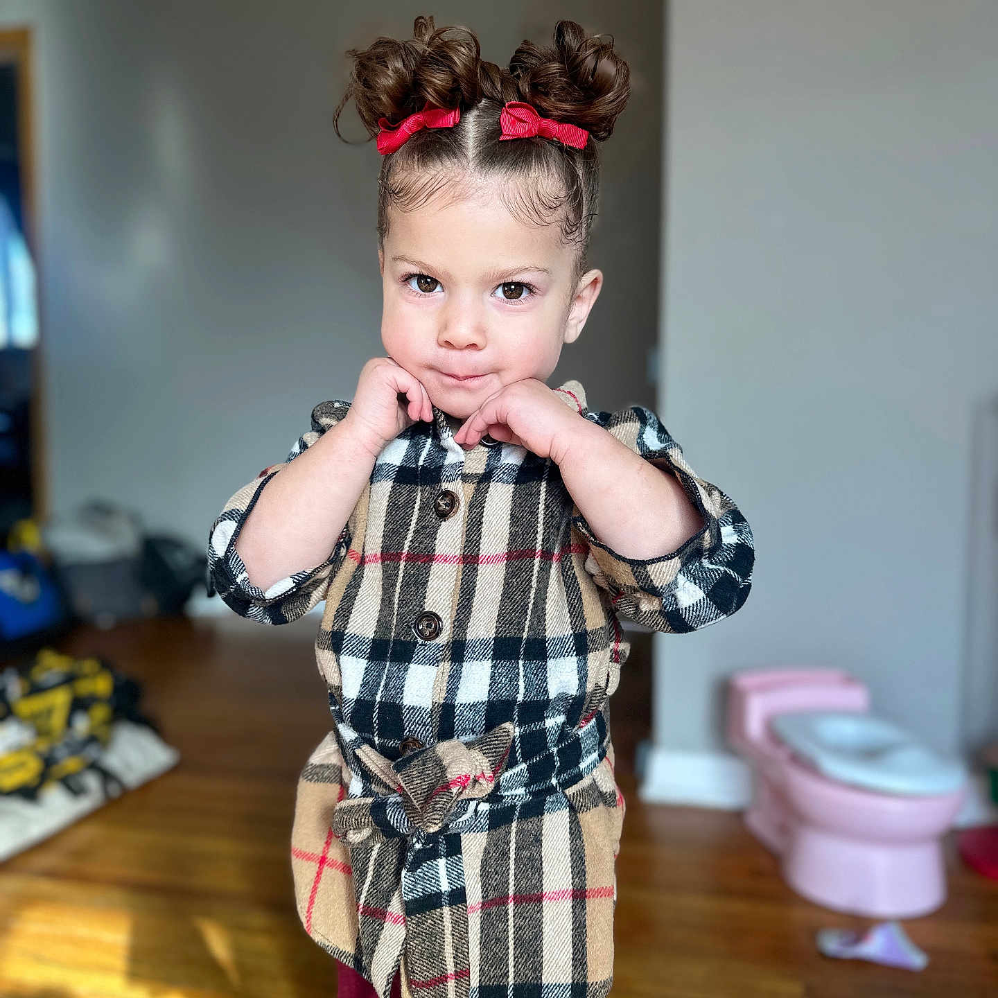 Melina is registered to the contest to win money with this photo: accessories, baby, bathroom, bodypart, clothing, face, finger, hand, happy, hardwood, head, indoors, interiordesign, pants, person, photography, portrait, room, toilet, wood