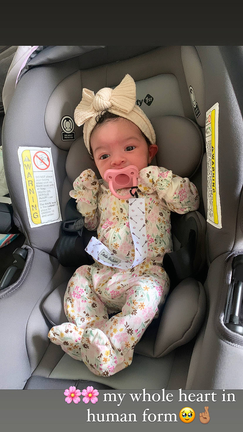 Denver is registered to the contest to win money with this photo: auto_part, automotive_design, baby, baby_carriage, baby_in_car_seat, baby_products, baby_safety, baby_toddler_clothing, car_seat, car_seat_cover, child, comfort, family_car, headwear, helmet, lap, luxury_vehicle, motor_vehicle, person, sitting
