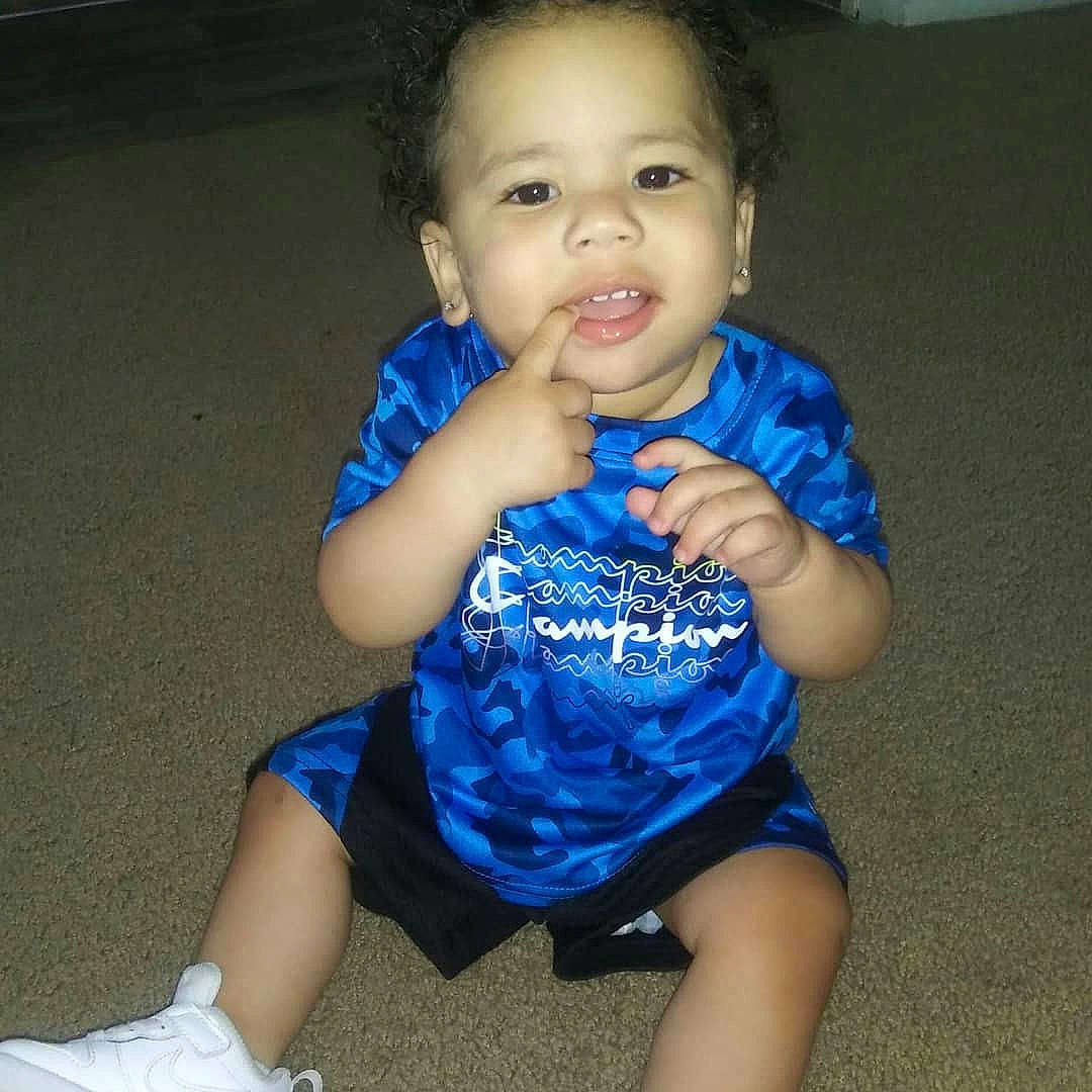 Dellavonte is registered to the contest to win money with this photo: arm, baby, baby_toddler_clothing, blue, cheek, child, electric_blue, mouth, person, sitting, smile, toddler