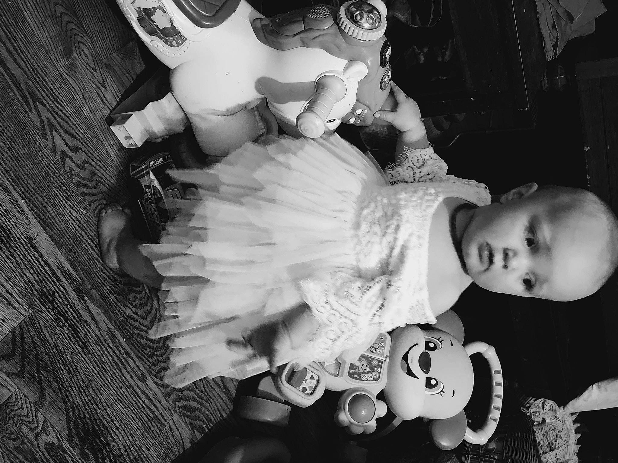 Shelby joined the competition — help win amazing prizes! baby, baby_toddler_clothing, black, black_and_white, cheek, eye, facial_expression, flash_photography, hand, happy, headgear, human, iris, mammal, person, photograph, skin, style, toy, vertebrate