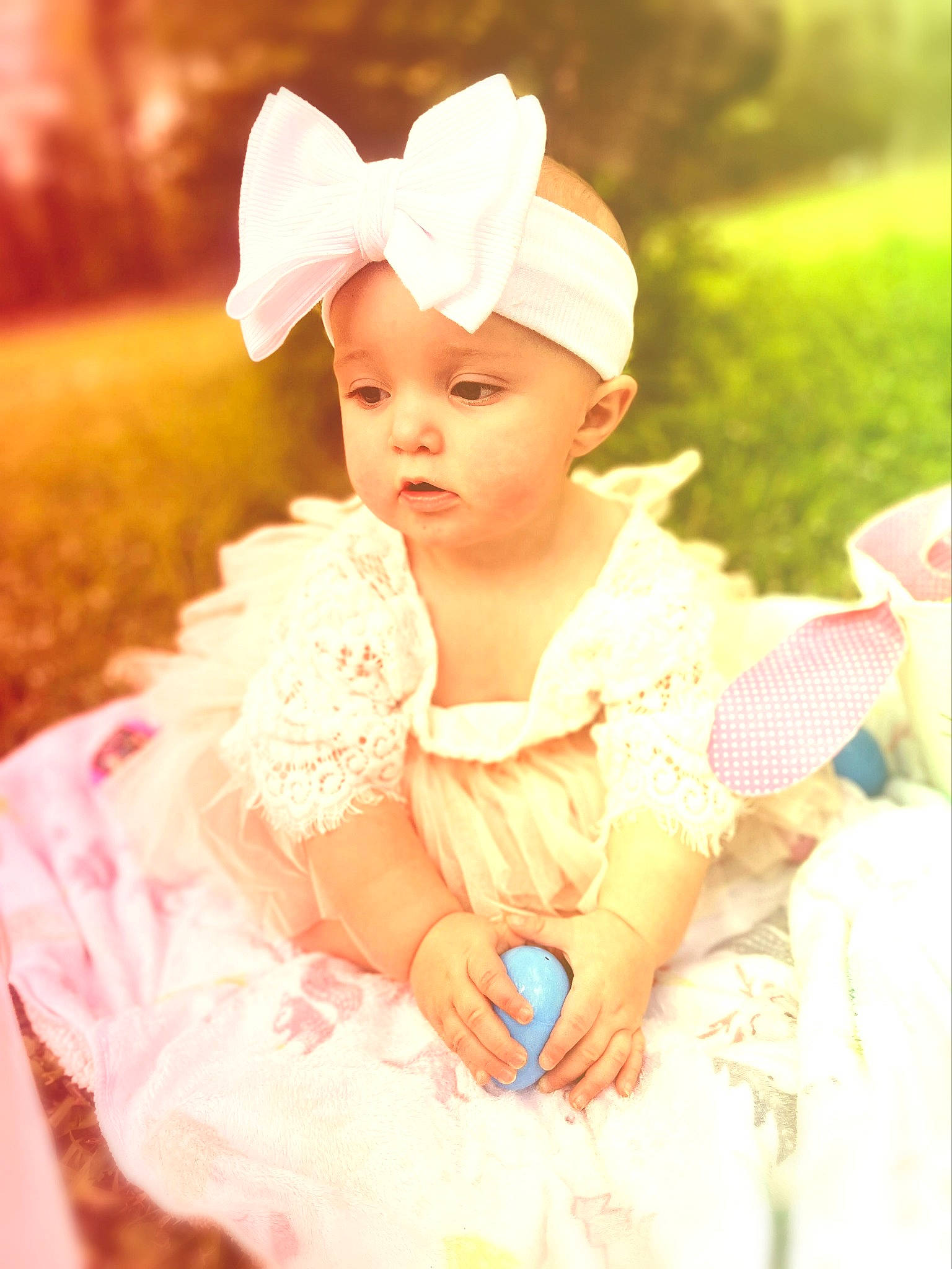Shelby is registered to the contest to win money with this photo: baby, baby_toddler_clothing, child, dress, embellishment, fashion_accessory, flash_photography, fun, grass, hair_accessory, happy, headband, headpiece, headwear, jewellery, peach, people_in_nature, person, pink, sitting