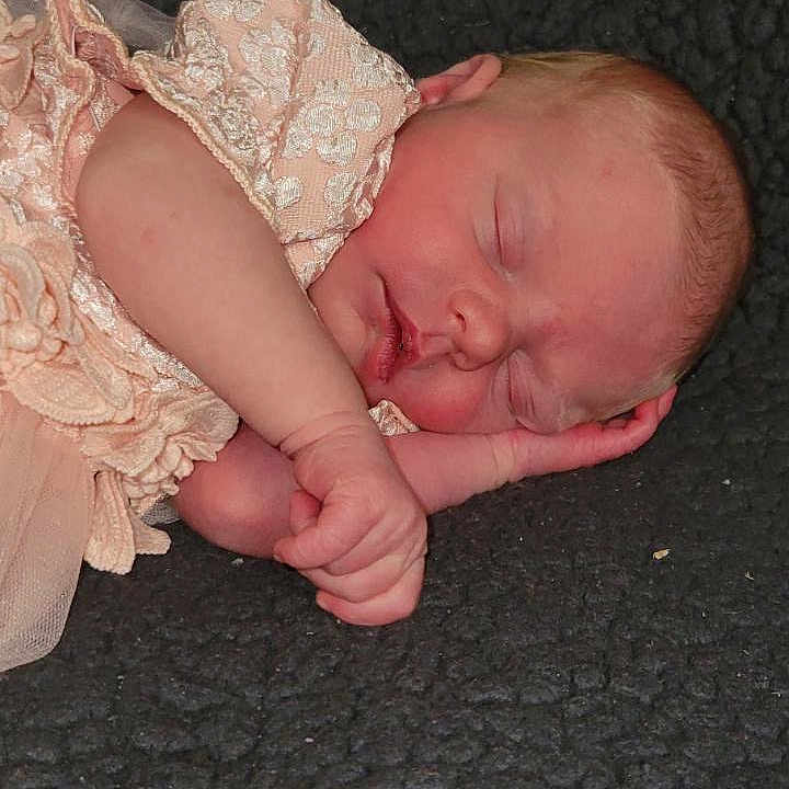 Corrine joined the competition — help win amazing prizes! accessories, arm, baby, blanket, bodypart, bonnet, clothing, dress, face, glove, hat, head, jewelry, newborn, person, photography, portrait, quilt, sleeping