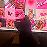 cat, silhouette, computer_screen, pink, portrait, woman, butterfly, hand, nails, fashion, hat, glasses, drink, monitor, dark, indoor, technology, colorful, artistic, curious