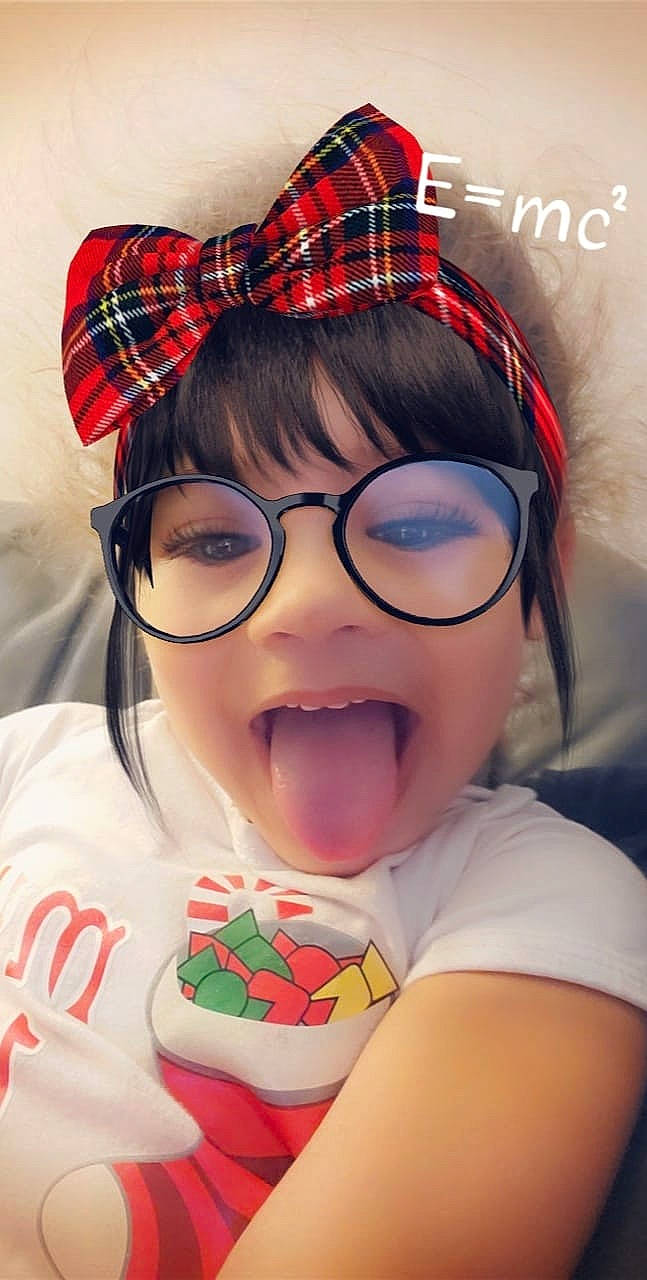 Bry'Lee Marie is registered to the contest to win money with this photo: child, cuisine, design, dessert, eating, eyewear, food, glasses, lip, mouth, pattern, person, sweetness, tartan