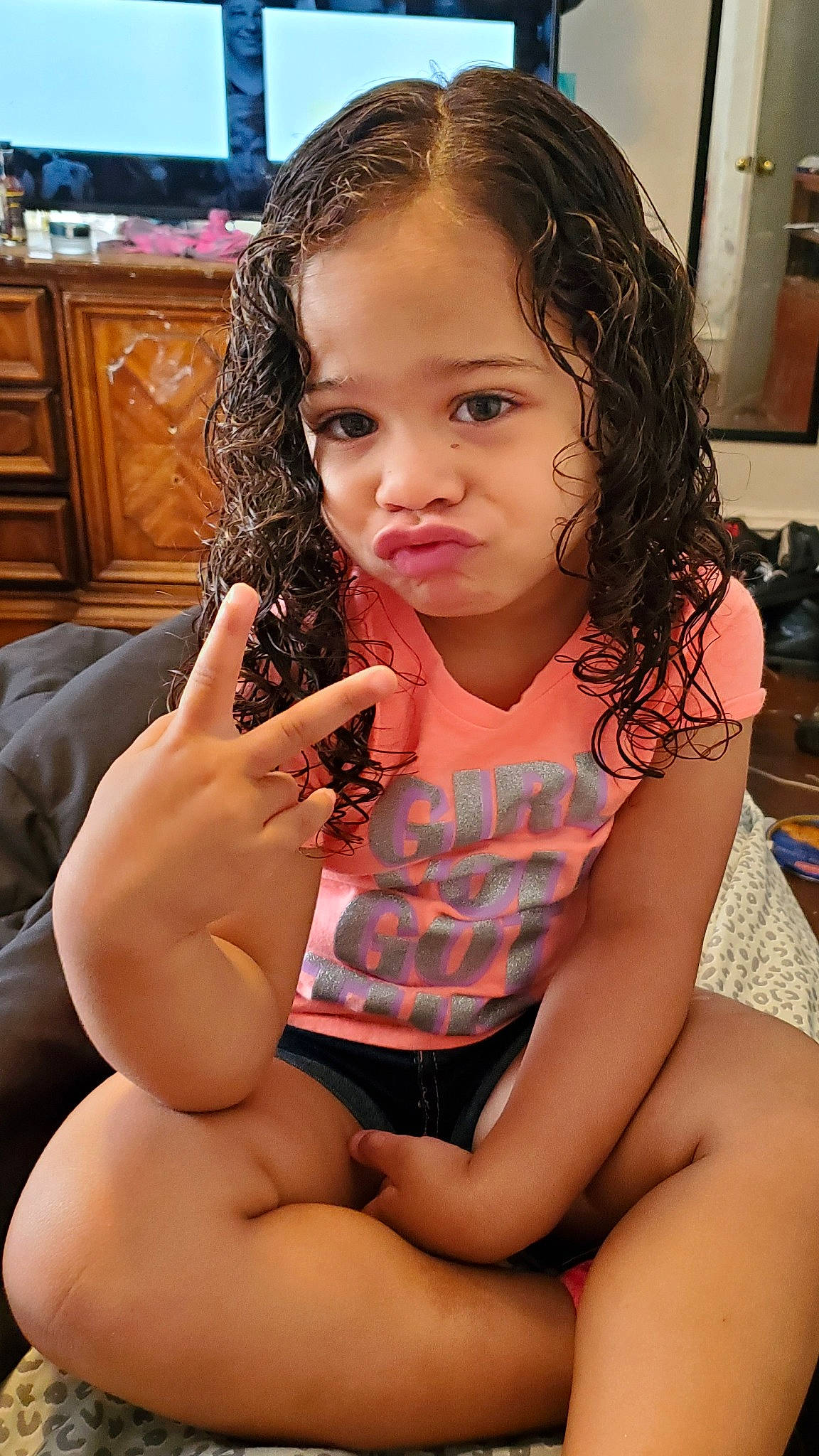 Bry'Lee Marie is registered to the contest to win money with this photo: black_hair, chest, child, eating, finger, neck, person, sitting, thumb, toddler