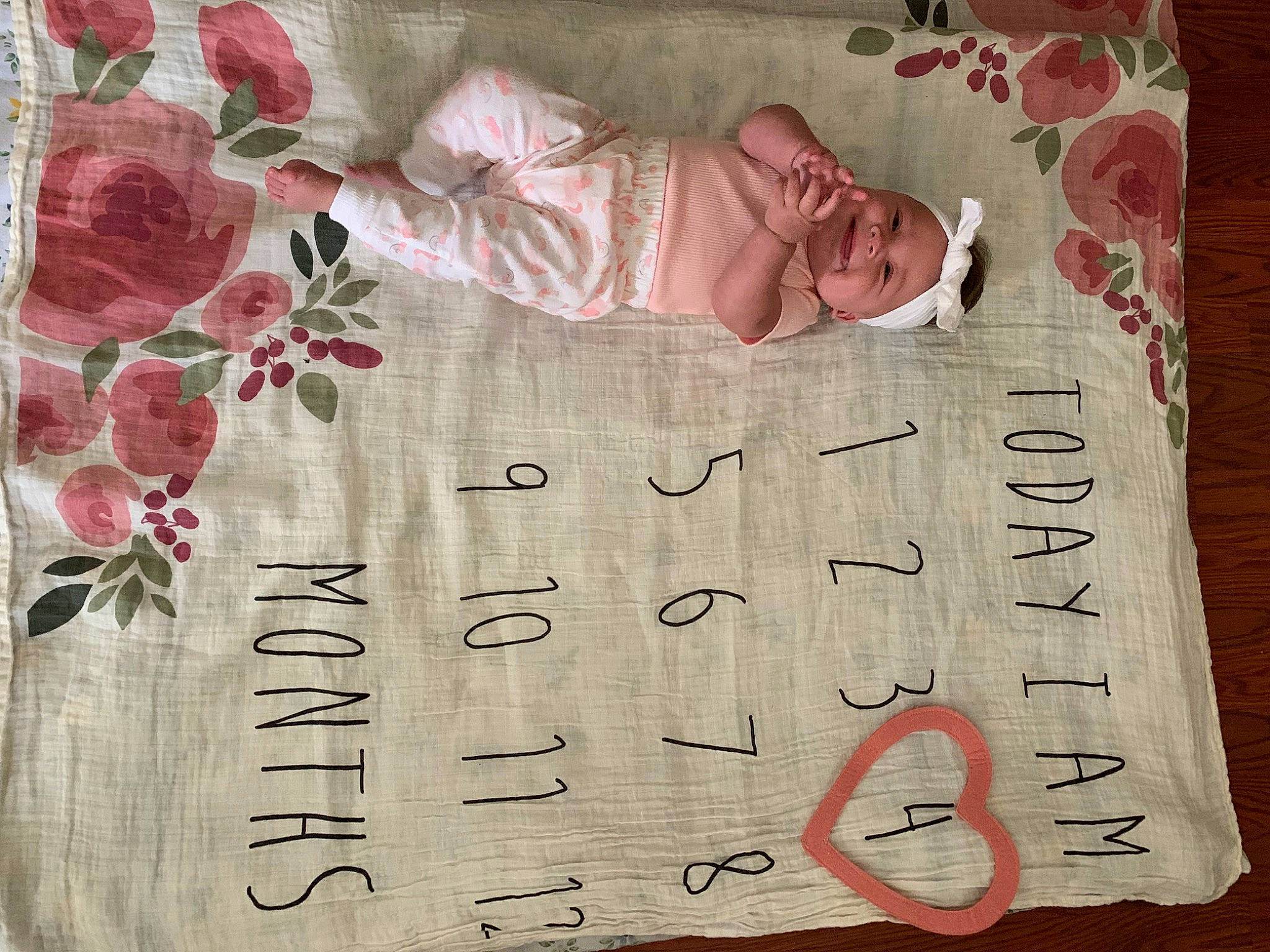 Kailani joined the competition — help win amazing prizes! baby, baby_toddler_clothing, flower, font, handwriting, happy, headwear, illustration, joy, linens, magenta, paper, paper_product, pattern, person, petal, pink, plant, sleeve, textile