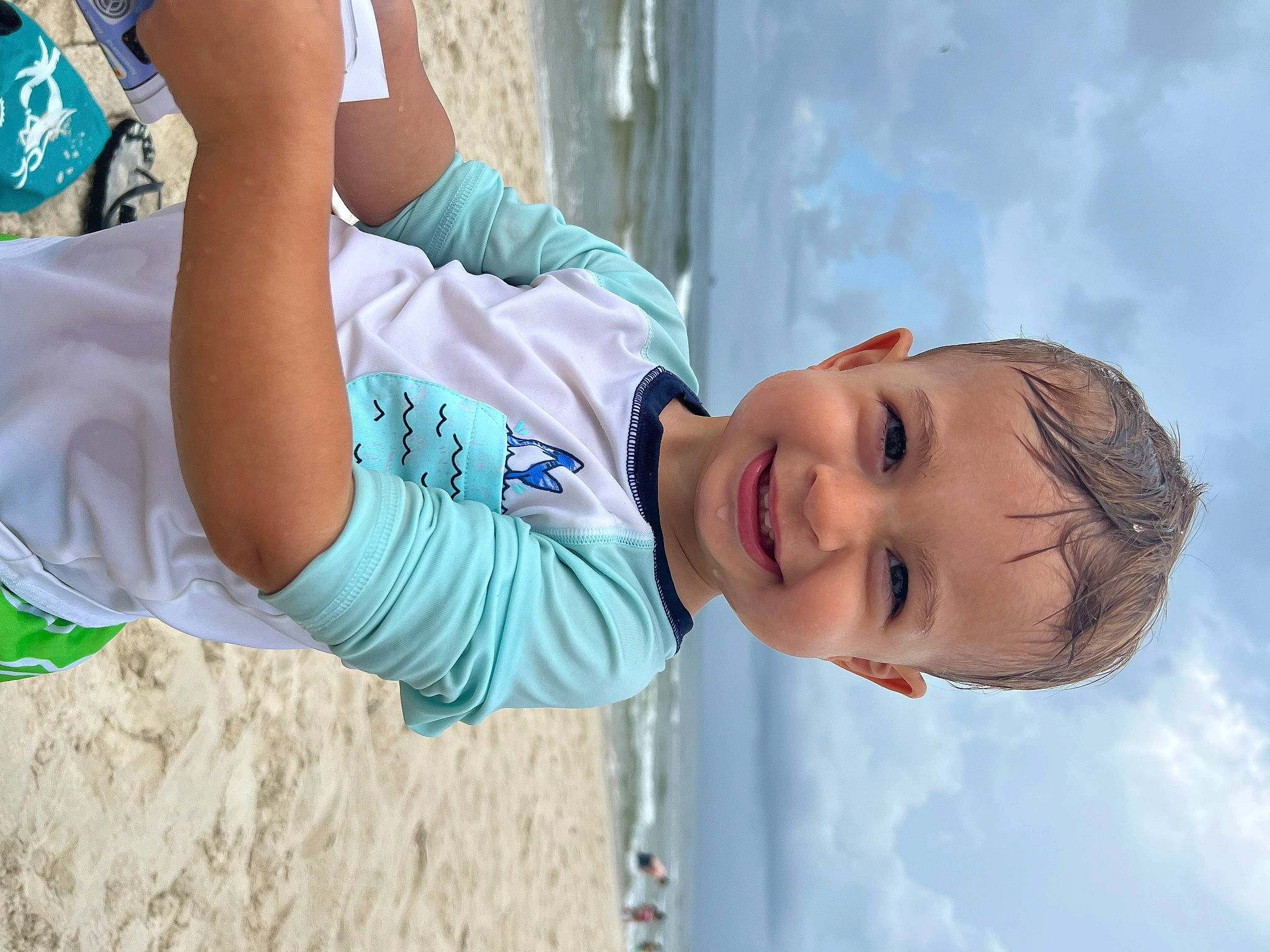 Bennett is registered to the contest to win money with this photo: azure, beach, child, cloud, cool, elbow, electric_blue, fun, happy, hat, joy, leisure, person, recreation, sand, shorts, sky, smile, t_shirt, toddler