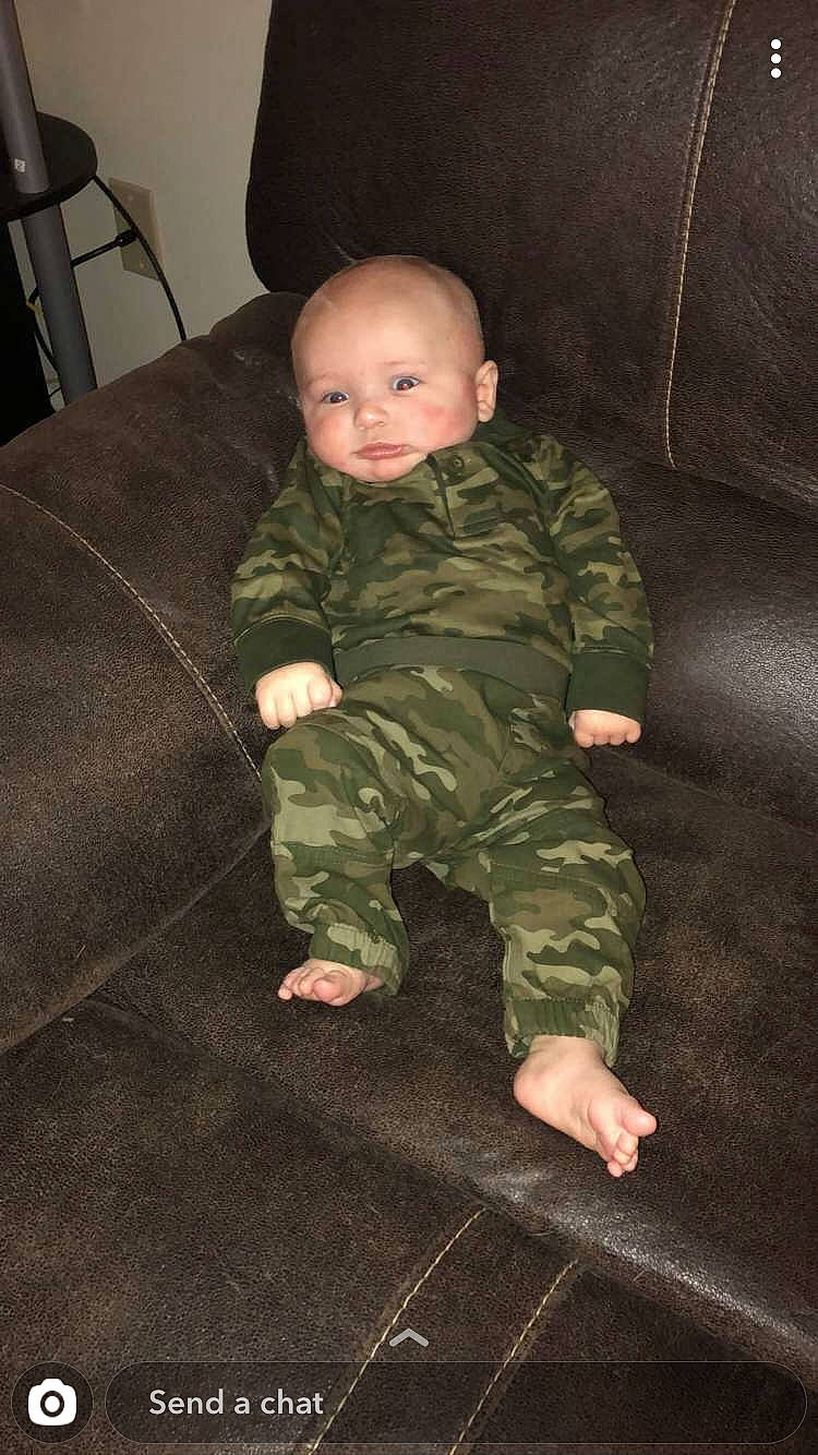 Maison is registered to the contest to win money with this photo: baby, child, crawling, military_camouflage, pattern, person, soldier, toddler