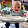 baby, swing, outdoor, toy, happy, child, smiling, clothing, face, person, play, seat, fabric, sock, hand, wood, fence, furniture, background, blanket