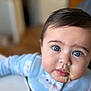 Aaliyah joined the competition — help win amazing prizes! baby, child, blue_eyes, face, messy_face, onesie, clothing, table, indoor, portrait, cute, infant, young_child, expression, skin, hair, person, food, closeup, home
