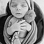 newborn, baby, infant, sleeping, hat, pompom, swaddle, blanket, feet, hands, portrait, black_and_white, monochrome, closeup, cozy, soft_texture, bucket, wooden_floor, studio_photography, peaceful