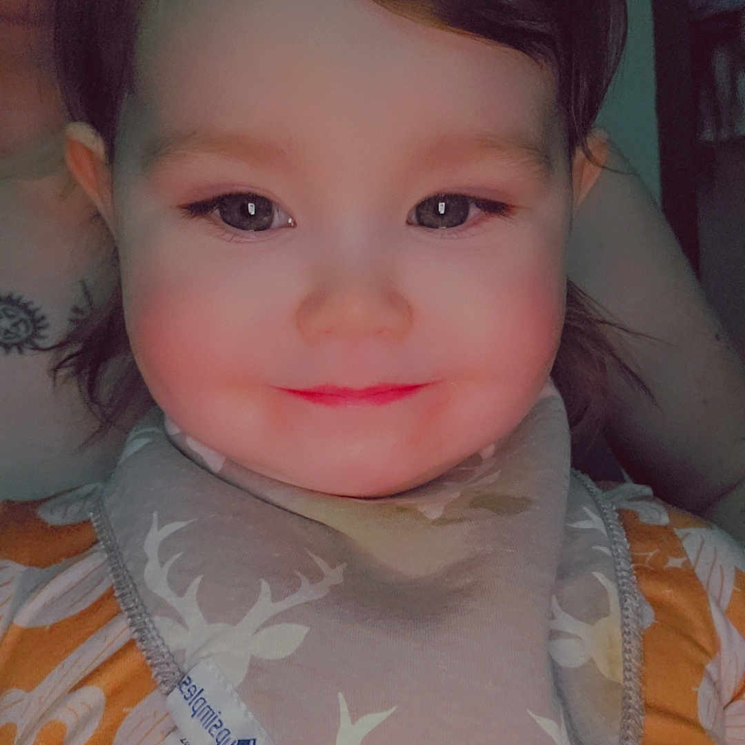 Thea joined the competition — help win amazing prizes! accessories, applique, baby, bib, bodypart, clothing, cosmetics, dress, face, fashion, formalwear, gown, head, headband, lipstick, mouth, pattern, person, photography, portrait