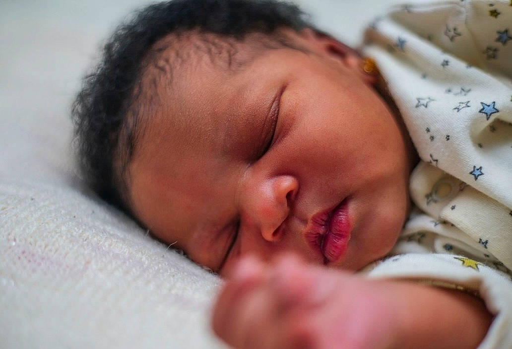 Mathew is registered to the contest to win money with this photo: baby, cheek, child, chin, comfort, eye, eyebrow, eyelash, face, gesture, hair, happy, head, linens, lip, mouth, nose, person, skin, textile