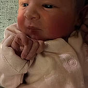 Rubie joined the competition — help win amazing prizes! baby, newborn, infant, face, hand, clothing, pink, skin, closeup, portrait, cute, sleepy, soft, newborn_clothes, small_hands, resting, indoors, child, person, baby_girl