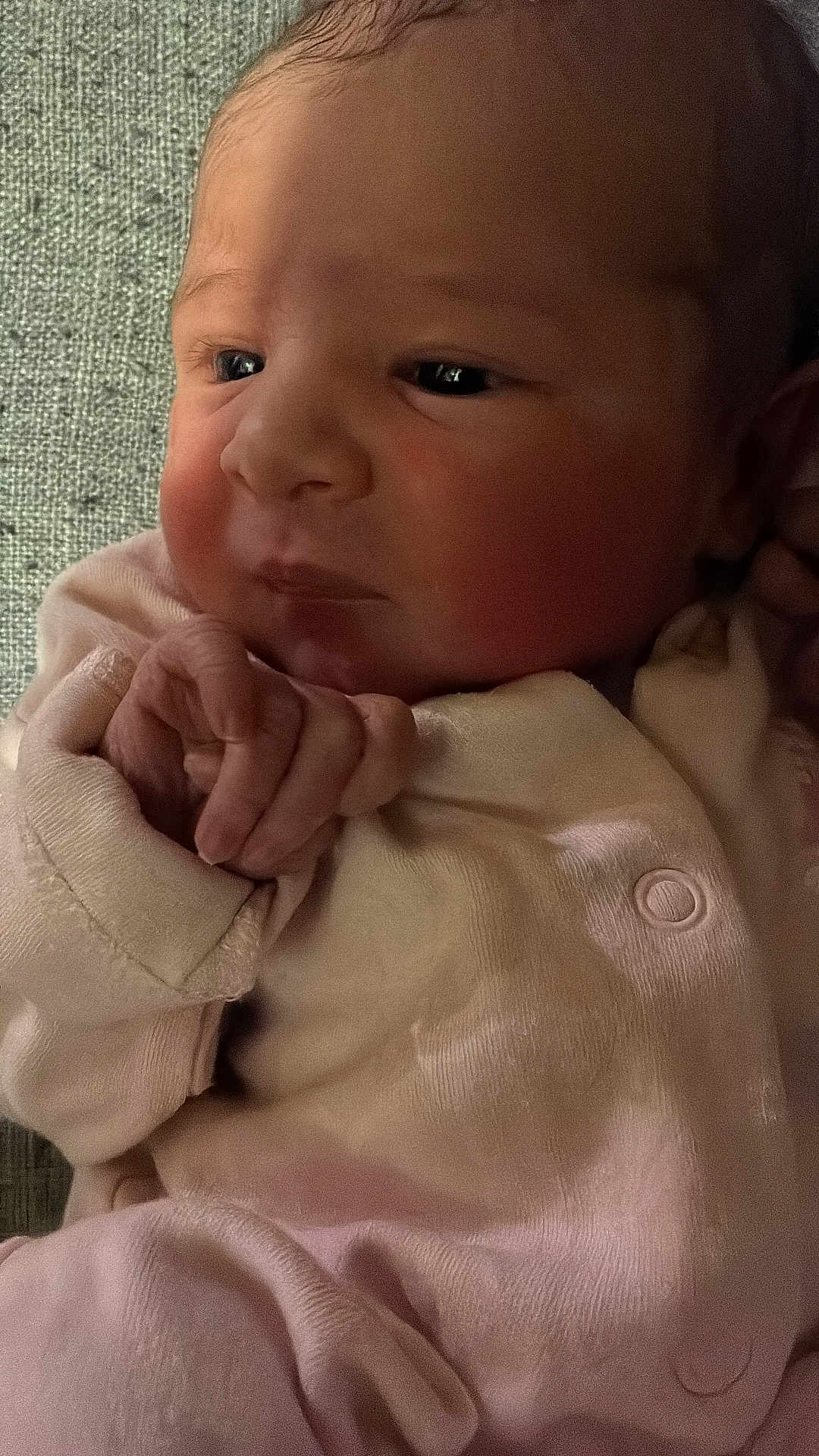 Rubie joined the competition — help win amazing prizes! baby, newborn, infant, face, hand, clothing, pink, skin, closeup, portrait, cute, sleepy, soft, newborn_clothes, small_hands, resting, indoors, child, person, baby_girl