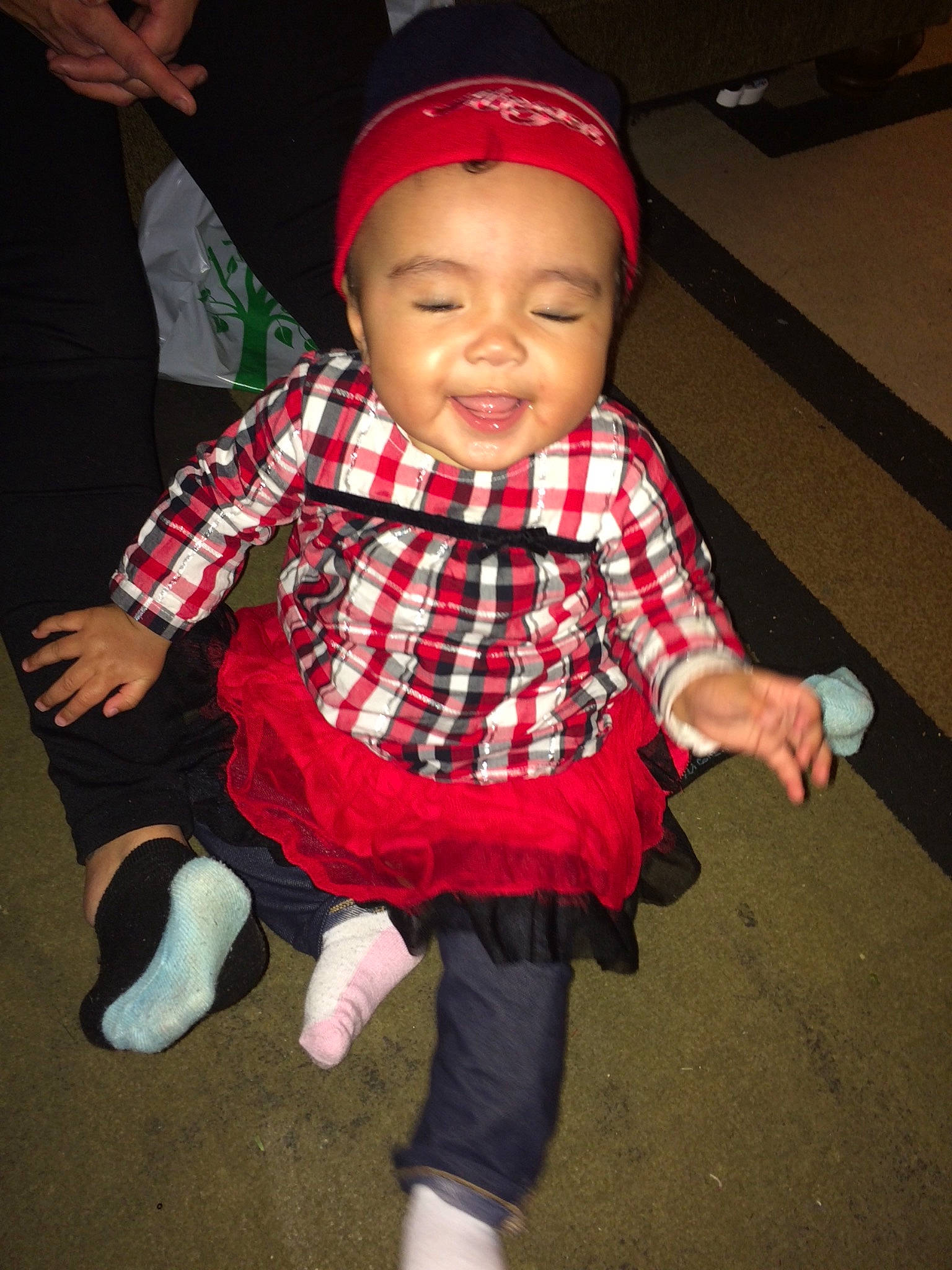 Aya is registered to the contest to win money with this photo: baby, child, fun, joy, person, plaid, toddler