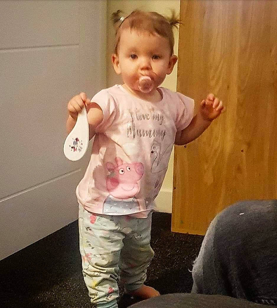 Kaitlyn is registered to the contest to win money with this photo: arm, baby, baby_toddler_clothing, cheek, child, finger, joint, person, play, shoulder, sleeve, smile, standing, t_shirt, toddler