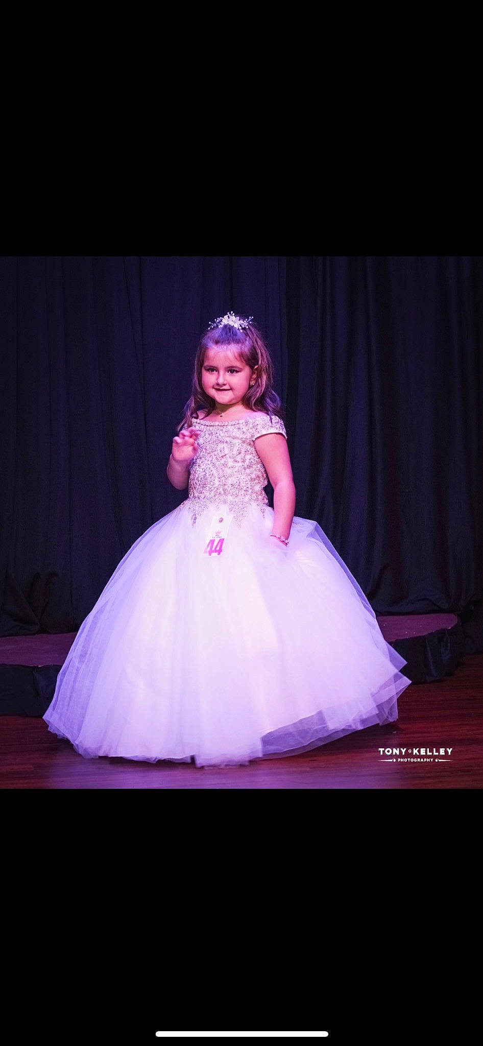 Sarai joined the competition — help win amazing prizes! bridal_accessory, bridal_clothing, bridal_party_dress, curtain, dress, entertainment, event, fashion_design, flash_photography, formal_wear, gown, happy, joy, magenta, performing_arts, person, petal, pink, purple, smile