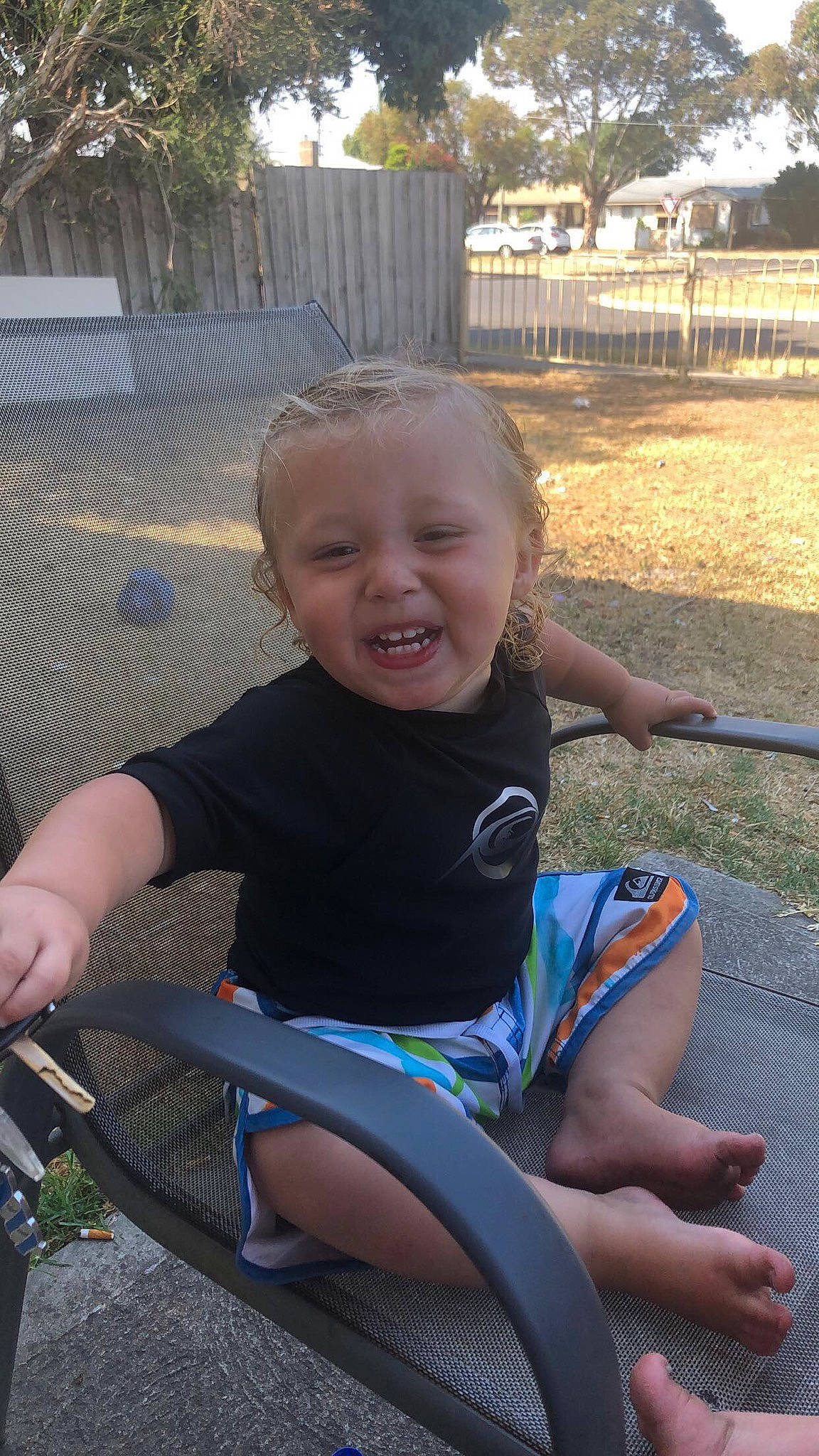 Kayleb is registered to the contest to win money with this photo: child, fun, joy, leg, leisure, person, sitting, smile, summer, toddler, vacation