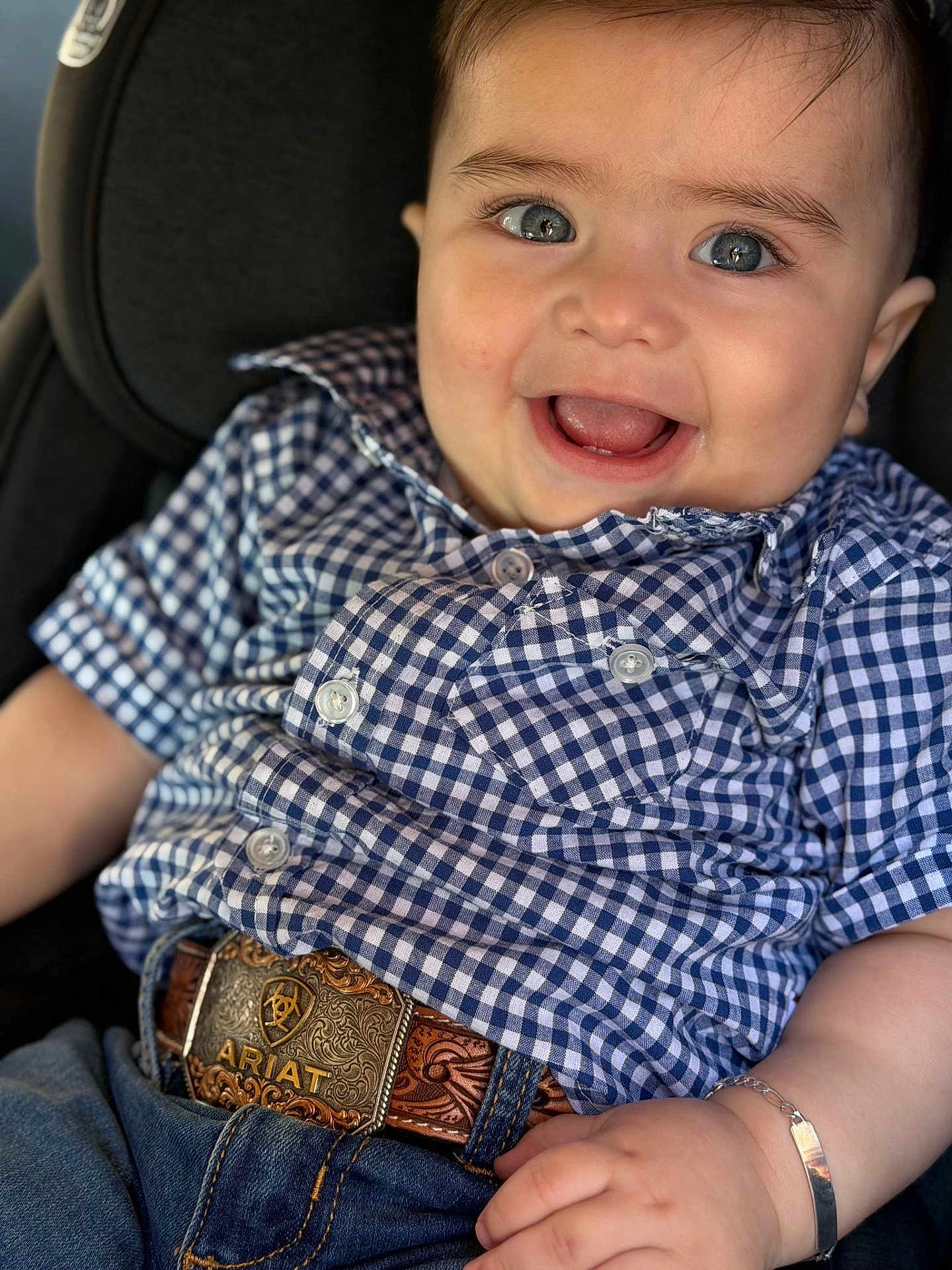 Dylan joined the competition — help win amazing prizes! baby, child, blue_eyes, smile, happy, checkered_shirt, denim, belt, bracelet, closeup, portrait, sitting, cute, infant, fashion, clothing, accessory, face, skin, person